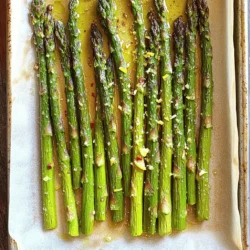 - 1 pound fresh asparagus, trimmed - 3 tablespoons olive oil - 4 cloves garlic, minced - Zest of 1 lemon - Juice of 1 lemon - 1 teaspoon sea salt - ½ teaspoon black pepper - ¼ teaspoon red pepper flakes (optional for heat) - 2 tablespoons grated Parmesan cheese (optional) When choosing asparagus, look for bright green stalks. They should feel firm and crisp. Avoid any that appear limp or have dark spots. For this recipe, the asparagus should be trimmed well. This means cutting off the tough ends, usually about 4-5 inches from the bottom. You want only the tender part. The flavorings are where this dish shines. Olive oil brings richness, while garlic adds a strong aroma. The lemon zest and juice offer a refreshing zing. This combination makes the dish bright and lively. For seasoning, sea salt enhances the natural flavors. Black pepper gives a mild heat, while red pepper flakes can add more spice if you like. If you want to elevate the dish, sprinkle grated Parmesan on top. It melts beautifully and adds a savory touch. For more details, check the Full Recipe. 1. Preheat the oven to 425°F (220°C). 2. Rinse and trim the asparagus. Start by washing it under cool water. Cut off the tough ends, leaving about 4-5 inches of the tender stalk. 3. Whisk together the lemon garlic mixture. In a bowl, combine 3 tablespoons of olive oil, 4 minced garlic cloves, the zest and juice of 1 lemon, 1 teaspoon of sea salt, ½ teaspoon of black pepper, and red pepper flakes if you like heat. 4. Toss the asparagus with the mixture. Add the trimmed asparagus to the bowl. Make sure every spear gets a nice coat of that zesty mixture. 5. Spread asparagus on a baking sheet. Lay the coated asparagus in a single layer on a parchment-lined baking sheet. 6. Roast asparagus for 12-15 minutes. Check for that vibrant color and tender-crisp texture. 7. Add cheese during the last minutes of roasting. If you're using Parmesan cheese, sprinkle it over the asparagus in the last 2 minutes for a melty finish. Enjoy your Lemon Garlic Roasted Asparagus as a delightful side dish with any meal. For the full recipe, check the details mentioned above. When choosing asparagus, look for bright green stalks. The tips should be firm and closed. If the stalks bend but do not break, they are fresh. Avoid any that are wilted or yellow. Fresh asparagus makes all the difference in taste and texture. Roasting asparagus is simple. Preheat your oven to 425°F (220°C). Spread the asparagus evenly on the baking sheet. Roast for about 12 to 15 minutes. Keep an eye on it. You want the asparagus to be vibrant in color and tender-crisp. You can test it by piercing a stalk with a fork. If it goes in easily, it's done! Lemon garlic roasted asparagus shines as a side dish. It pairs well with grilled meats like chicken or fish. You can also serve it alongside pasta or rice. For a great twist, add it to salads or grain bowls for a fresh crunch. {{image_2}} You can easily change the flavor of your Lemon Garlic Roasted Asparagus. Try adding herbs like thyme or rosemary. These herbs bring a fresh twist. Just sprinkle a little on before roasting. You’ll be amazed at how a small change makes a big difference. If you want to switch up the cheese, go for feta or goat cheese. These cheeses offer a creamy, tangy flavor that pairs well with asparagus. Sprinkle them on just before serving. This will add a rich taste that everyone will love. For a little kick, use cayenne pepper instead of red pepper flakes. A pinch can change the heat level. Adjust it to your taste. This small swap can turn your dish into a spicy delight. Store your Lemon Garlic Roasted Asparagus in an airtight container. It stays fresh in the fridge for up to 3 days. Just remember to cool it down before sealing. This way, it keeps its great flavor and texture. If you want to freeze it, first blanch the asparagus. Dunk it in boiling water for a minute, then transfer it to ice water. This helps preserve the color and taste. Once cooled, drain and pack it into freezer bags. You can store it for up to three months. Reheating is easy! The best way to bring back its crispness is to use the oven. Preheat it to 350°F (175°C) and heat the asparagus for about 10 minutes. This keeps it tasty and fresh. If you're in a hurry, you can use the microwave, but it might lose some crunch. For the full recipe, check out the recipe section. Fresh asparagus is recommended for optimal texture. Frozen asparagus may become mushy. Fresh spears hold their shape and crunch better. If you can find fresh, choose it for this dish. It should be vibrant in color and tender-crisp. Look for a bright green hue. You can test it by poking a spear with a fork. It should give a little but not be soft. Asparagus is rich in vitamins A, C, E, and K, as well as fiber and antioxidants. These nutrients support your immune system and promote healthy skin. Eating asparagus can aid digestion and boost overall health. Perfect alongside grilled chicken, fish, or as a topping for salads. This dish adds a fresh flavor to any meal. The lemon and garlic pair well with many proteins. Enjoy this asparagus as a vibrant side that enhances your dining experience. In this post, I shared a simple recipe for Lemon Garlic Roasted Asparagus. We covered choosing fresh asparagus, mixing key ingredients, and roasting techniques. I also discussed storage tips and serving ideas. Remember, fresh asparagus shines best with lemon and garlic. Try different herbs and cheeses to make it your own. Enjoy this healthy side dish and explore how it complements various meals. Happy cooking!