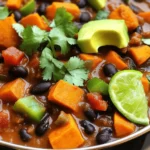 To make your Sweet Potato Black Bean Chili, gather these key ingredients: - 2 medium sweet potatoes, peeled and diced - 1 can (15 oz) black beans, rinsed and drained - 1 can (14 oz) diced tomatoes (with juice) - 1 cup vegetable broth - 1 red bell pepper, diced - 1 green bell pepper, diced - 1 medium onion, chopped - 3 cloves garlic, minced - 2 tablespoons olive oil - 2 tablespoons chili powder - 1 teaspoon cumin - ½ teaspoon smoked paprika - Salt and pepper to taste These ingredients bring a rich taste and texture to your chili, making it a hearty meal. You can enhance your chili with these tasty toppings: - Chopped cilantro - Avocado slices - Lime wedges These toppings add flavor and freshness. Each serving of Sweet Potato Black Bean Chili contains: - Calories: Approximately 250 - Protein: 10 grams - Carbohydrates: 45 grams - Fiber: 12 grams - Fat: 5 grams This chili is packed with nutrients, making it a healthy choice. Enjoy the full recipe to see how these ingredients come together! Start by peeling and dicing the sweet potatoes. You will need two medium ones. Next, chop one medium onion, and mince three cloves of garlic. Dice one red bell pepper and one green bell pepper. You want all the veggies chopped and ready. This makes cooking smooth and quick. Heat two tablespoons of olive oil in a large pot over medium heat. Add the chopped onion first. Sauté it until it turns soft and clear, about five minutes. Then, mix in the minced garlic, two tablespoons of chili powder, one teaspoon of cumin, and half a teaspoon of smoked paprika. Cook this mix for one more minute. It should smell great! Next, add the diced sweet potatoes and bell peppers to the pot. Stir them well to coat with the spices. Pour in one can of diced tomatoes (with juice) and one cup of vegetable broth. Stir it all together and bring the mix to a simmer. Once it bubbles, lower the heat. Cover the pot and let it cook for 20-25 minutes. Check that the sweet potatoes are tender. When they are soft, add one can of black beans, rinsed and drained. Stir the beans in and let the chili simmer for another five minutes. When the cooking time is up, take the pot off the heat. Taste the chili and add salt and pepper as needed. You can also adjust the spice with more chili powder if you like it hot. Let the chili cool for a moment. Serve it hot in bowls. For extra flavor, top it with fresh cilantro, avocado slices, and lime wedges. Enjoy every bite of your Sweet Potato Black Bean Chili! For the full recipe, check out the complete instructions above. To boost flavors in your chili, use fresh herbs. Cilantro adds a bright taste. Squeeze some lime juice just before serving for a zesty kick. You can also add a splash of soy sauce or hot sauce for depth. These small changes make a big difference in taste. When cooking sweet potatoes, cut them into even pieces. This helps them cook evenly. Peel them before dicing for a better texture. Boil or steam them until fork-tender before adding to the chili. This keeps them soft and flavorful. If you like heat, add more chili powder or diced jalapeños. For less spice, use a milder chili powder. You can also remove the seeds from peppers for less heat. Taste as you go to find your perfect balance. Adjust slowly, so it fits your taste. For the complete recipe, check the [Full Recipe]. {{image_2}} You can easily make this chili vegan and gluten-free. All the ingredients in this recipe are naturally vegan. Sweet potatoes and black beans are great sources of protein and nutrients. For gluten-free options, be sure to check your vegetable broth for any added gluten. Most brands are safe, but it’s wise to confirm. Feel free to swap ingredients for a new twist. Instead of sweet potatoes, you can use butternut squash. It adds a sweet and nutty flavor. You could also try kidney beans or pinto beans instead of black beans. To spice things up, add jalapeños or chili flakes. For a smoky taste, you could use chipotle peppers. Experimenting with these swaps can lead to exciting new flavors. Pair your chili with tasty sides for a complete meal. Cornbread is a classic choice and complements the chili well. You can serve it with tortilla chips for a crunchy texture. Another great option is a fresh salad with lime dressing. For a fun twist, try serving the chili over rice or quinoa. Each bite will be packed with flavor. For more details, check the full recipe. To keep your Sweet Potato Black Bean Chili fresh, store it in an airtight container. Let the chili cool down before sealing. This helps prevent moisture buildup. Place your container in the fridge if you plan to eat it within three to four days. If you want to store it longer, follow the next steps. Reheating your chili is simple. Pour your desired amount into a pot. Heat it over medium-low heat on the stove. Stir often to prevent it from sticking. You can also use the microwave. Heat for 1-2 minutes, stirring halfway through. Ensure it's hot throughout before serving. If it seems thick, add a splash of broth or water. Freezing is a great way to save your chili for later. Use freezer-safe bags or containers. Make sure to leave some space at the top as the chili will expand. Label the bags with the date. You can freeze it for up to three months. When you’re ready to enjoy it, thaw it overnight in the fridge before reheating. Enjoy the flavor of your Sweet Potato Black Bean Chili even after weeks! For the full recipe, check out the details above. Yes, you can! To make this chili in a slow cooker, follow these steps. First, prepare the veggies as you would for the stovetop method. Sauté the onion and garlic in a pan with olive oil. Then, add all the ingredients to your slow cooker, including the sautéed onion and garlic. Cook on low for about 6-8 hours or high for 3-4 hours. This method makes the flavors blend nicely and gives you a hearty meal. Sweet potatoes are rich in vitamins, especially vitamin A. They also provide fiber and antioxidants. Black beans are high in protein and fiber, which helps keep you full. Together, they support heart health and digestion. This chili packs nutrients while tasting amazing, making it a smart choice for your meals. To spice it up, add more chili powder or some diced jalapeños. You can also use hot sauce for an extra kick. If you prefer it milder, reduce the chili powder. You can also add some sugar or honey to balance the heat. Adjusting spice levels lets you create a version just for your taste. This blog post offers a complete guide to making Sweet Potato Black Bean Chili. It covers essential ingredients, cooking steps, and tips for extra flavor. You can adjust spice levels and even find vegan options. Storage techniques and reheating methods are included for your convenience. Remember, making this chili is fun and rewarding. Experiment with flavors and enjoy your delicious meals!
