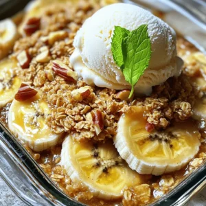 To make a tasty Bananas Foster Crisp, you need simple and fresh ingredients. Here’s what you will need: - 4 ripe bananas, sliced - 1 cup rolled oats - 1/2 cup brown sugar - 1/2 cup all-purpose flour - 1/2 teaspoon ground cinnamon - 1/4 teaspoon nutmeg - 1/4 cup unsalted butter, melted - 1/4 cup chopped walnuts or pecans (optional) - 1 cup vanilla ice cream (for serving) - Fresh mint leaves for garnish (optional) Using ripe bananas is key. They should be soft and sweet for the best flavor. Rolled oats add a nice crunch to the dish. Brown sugar gives it a deep sweetness. The flour helps bind the topping. Ground cinnamon and nutmeg add warmth and spice. You can use unsalted butter to help the topping crisp up nicely. The optional nuts add texture and flavor. I love using walnuts, but pecans are great too. For serving, vanilla ice cream is a must. It melts into the warm crisp and makes it even more delicious. Fresh mint leaves can add a pop of color and a fresh taste. For the full recipe, you can check out the details to get started! 1. First, preheat your oven to 350°F (175°C). This step makes sure your dish bakes evenly. 2. Next, slice 4 ripe bananas and place them in a bowl. Add 1/4 cup of brown sugar. Toss gently to coat the bananas. Set this mixture aside. 1. In another bowl, combine 1 cup of rolled oats, 1/2 cup of all-purpose flour, and the rest of the brown sugar (1/4 cup). 2. Add 1/2 teaspoon of ground cinnamon and 1/4 teaspoon of nutmeg to the mix. 3. Pour in 1/4 cup of melted unsalted butter. If you like, add 1/4 cup of chopped walnuts or pecans. Mix until combined. 4. Grease a baking dish. Spread the banana mixture evenly in the dish. 5. Sprinkle the oat topping over the bananas. Make sure it covers the bananas completely. 1. Place the dish in the oven. Bake for 25-30 minutes. Watch for a golden brown topping and bubbly bananas. 2. Once done, take it out and let it cool for a few minutes. This makes it easier to serve. 3. Serve warm with a scoop of vanilla ice cream on top. You can add fresh mint leaves for a nice touch. Enjoy making this delightful dessert! For the complete recipe, check out the Full Recipe. Choosing the right bananas is key for great flavor. You want ripe bananas for this dish. Look for bananas with yellow skin and some brown spots. This shows they are sweet and soft. Avoid green bananas; they are not sweet enough for baking. To get the perfect crunch on your oat topping, use rolled oats. Mix them with flour, brown sugar, and melted butter. This combination gives a nice, crispy layer. You can add nuts for more texture. Walnuts or pecans work well. If you want a twist, try adding coconut flakes or seeds. Serve your Bananas Foster Crisp warm. A scoop of vanilla ice cream on top adds creaminess. You can also garnish with fresh mint leaves for color. For a fun twist, drizzle some caramel sauce over the top. Arrange it in a nice bowl to make it look special. For the full recipe, check out the detailed steps above! {{image_2}} To make Bananas Foster Crisp your own, try using different nuts or seeds. You can replace walnuts or pecans with almonds or sunflower seeds. Each will add a new crunch and flavor. If you're looking for healthier options, swap out the brown sugar. You could use coconut sugar or maple syrup. These swaps keep the dessert sweet while adding unique flavors. Want to amp up the taste? Add chocolate chips or dried fruits like raisins or cranberries to the oat topping. This twist adds richness and sweetness. You can also infuse spices for extra flavor. Try a hint of ginger or a dash of vanilla extract. Both will give your dish a warm and inviting aroma. For a gluten-free version, use almond flour or gluten-free oats instead of regular flour. This keeps the crunch and flavor intact. Ensure all your ingredients are certified gluten-free. This way, you can enjoy your dessert without worry. You won't lose any taste with these changes! To keep Bananas Foster Crisp fresh, place it in an airtight container. Store it in the fridge. This way, it stays safe and tasty. You can keep it for up to three days. After that, the texture may change, and the flavors fade. When you reheat, use the oven for the best results. Set the oven to 350°F (175°C). Put the crisp in a baking dish, cover it with foil, and heat for about 15 minutes. This keeps the topping crunchy and the bananas soft. You can freeze Bananas Foster Crisp, but it’s best to eat it fresh. If you freeze it, wrap it tightly and use it within a month. You can prepare Bananas Foster Crisp a day in advance. Store the layered dish in the fridge before baking. When you are ready, bake it as per the instructions. This helps save time when you want to serve it. For fresh taste, serve it warm with ice cream right after baking. Bananas Foster Crisp is a warm dessert made with bananas and a crunchy topping. It blends sweet, soft bananas with a crispy oat layer. This dish comes from New Orleans, where it gained fame. The classic Bananas Foster features flambéed bananas. In this twist, we bake ripe bananas with oats. The result is a cozy treat perfect for sharing. Yes, you can swap bananas for other fruits. Apples and peaches work well in this recipe. Berries like blueberries or strawberries add a fresh twist. Just make sure the fruit is ripe and sweet. This way, you keep the flavor bright and enjoyable for everyone. To make a vegan version, replace the butter with coconut oil or vegan butter. Use maple syrup instead of brown sugar for sweetness. You can also skip the ice cream or use a plant-based option. These swaps keep the dish tasty while meeting vegan needs. Enjoy every bite without missing out! In this post, we explored the delicious recipe for Bananas Foster Crisp. We covered ingredients, step-by-step instructions, and helpful tips. You learned how to choose ripe bananas and perfect the oat topping. We also shared variations and storage tips to enhance your experience. Bananas Foster Crisp is not only tasty but also versatile. You can adapt it to fit your needs. Enjoy every bite and make it your own!