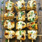 For these tasty grilled ranch garlic parmesan chicken skewers, you need: - 1.5 lbs boneless, skinless chicken breasts, cut into 1-inch cubes - ½ cup ranch dressing - 1 tablespoon garlic powder - ½ cup grated Parmesan cheese - 1 teaspoon black pepper - 1 teaspoon paprika - 1 tablespoon olive oil - 2 tablespoons fresh parsley, chopped (for garnish) - Skewers (wooden or metal) The key to these skewers is fresh chicken. I like boneless and skinless chicken breasts. They cook evenly and stay juicy. Ranch dressing gives a great flavor. It also helps the spices stick. Next, we need garlic powder. It adds a rich taste without overpowering the dish. I also use black pepper and paprika. These spices give a nice kick and color to the chicken. Finally, grated Parmesan cheese brings a creamy, salty touch. It's the finishing touch that makes these skewers special. Don't forget fresh parsley for garnish. It adds color and freshness. These ingredients work together to create a delightful dish. Each bite is full of flavor and satisfaction. Enjoy the process of making these skewers! First, gather your ingredients. You need ranch dressing, garlic powder, black pepper, and paprika. In a large bowl, mix these with olive oil. Stir until everything blends well. Then, add the cubed chicken. Make sure each piece is coated. This step helps the chicken soak up all the flavors. Cover the bowl with plastic wrap. Place it in the fridge for at least 30 minutes. If you have time, marinate for up to 2 hours. The longer it sits, the more taste it gains. If you use wooden skewers, soak them in water for 30 minutes. This prevents burning on the grill. If you use metal skewers, you can skip this step. Once the chicken is ready, it's time to assemble. Take the soaked skewers and thread the marinated chicken cubes onto them. Leave a little space between each piece. This helps them cook evenly. Now, preheat your grill to medium-high heat, around 400°F. Place the skewers on the grill. Cook for about 12-15 minutes. Turn them occasionally for even cooking. The chicken should reach an internal temperature of 165°F. When they are almost done, sprinkle grated Parmesan cheese on top. This step adds a rich, cheesy flavor. After grilling, remove the skewers and let them rest for a couple of minutes. Garnish with fresh parsley before serving. Enjoy! For the full recipe, check the Full Recipe section. Marinating the chicken is key to flavor. Start by mixing ranch dressing, garlic powder, black pepper, paprika, and olive oil. You want a nice blend. Make sure every chicken piece gets covered. Marinate for at least 30 minutes. If you let it sit longer, up to 2 hours, the taste gets even better. Keep it in the fridge for safety. To get those perfect grill marks, preheat your grill to medium-high heat. Aim for about 400°F or 200°C. Place the skewers on the grill, but don’t move them right away. Let them sit for about 4-5 minutes. This helps form those beautiful grill marks. After that, flip them to the other side for even cooking. Cook the skewers for about 12-15 minutes in total. Turn them occasionally to ensure even cooking. You want the chicken to reach an internal temperature of 165°F or 74°C. Use a meat thermometer for accuracy. In the last 2 minutes, sprinkle on the Parmesan cheese. This gives a nice finish to your skewers. For the full recipe, check the section above. {{image_2}} You can swap chicken for other proteins. Shrimp works well and cooks fast. Beef chunks also add rich flavor. Try using firm tofu for a plant-based twist. Just marinate it like chicken for the best taste. For a vegan or vegetarian option, use hearty vegetables. Bell peppers, zucchini, and mushrooms are great choices. You can also use tempeh or seitan. Marinate these like the chicken to keep the flavors strong. Want to kick up the flavor? Add spices like cayenne pepper for heat. A dash of lemon juice brightens the dish. Fresh herbs like thyme or rosemary can add depth. You can mix in different dressings too, like blue cheese or Caesar. These changes can make the skewers even more exciting. For the full recipe, check the section above. You can store leftover skewers easily. First, let them cool down. Place them in a shallow dish. Cover the dish with plastic wrap or use an airtight container. They can stay fresh in the fridge for up to 3 days. If you want to keep them longer, freezing is a good option. To reheat your skewers, use an oven for the best results. Preheat your oven to 350°F (175°C). Place the skewers on a baking sheet. Heat them for about 10-15 minutes. You can also use a microwave. Heat them for 1-2 minutes, but the oven gives better flavor. If you want to freeze the skewers, wrap them tightly in plastic wrap. Then, place them in a freezer bag. They can last up to 3 months in the freezer. When you're ready to eat them, thaw them in the fridge overnight. Then, reheat them using your preferred method. Enjoy those tasty flavors again! Check out the Full Recipe for more delicious tips. You should marinate the chicken for at least 30 minutes. This lets the flavors soak in. If you can, marinate for up to 2 hours for even more taste. The longer time makes the chicken juicier and more flavorful. These skewers pair well with many sides. Here are some tasty options: - Fresh green salad - Grilled vegetables - Rice or quinoa - Garlic bread - Creamy coleslaw These sides will add color and flavor to your meal. They make a great balance with the rich taste of the skewers. Yes, you can make these skewers in the oven. Preheat your oven to 400°F (200°C). Place the skewers on a baking sheet and cook for about 15-20 minutes. Turn them halfway through to get an even cook. You want the chicken to reach 165°F (74°C) for safety. The oven method gives you a nice option if grilling isn’t possible. In this blog post, we explored how to make delicious Grilled Ranch Garlic Parmesan Chicken Skewers. We covered essential ingredients like chicken and ranch dressing. I shared step-by-step instructions, including marinating and grilling tips. We also discussed variations for different diets and how to store leftovers. With the right ingredients and techniques, you can create a tasty meal. Don’t hesitate to experiment with flavors and share your results. Happy grilling!