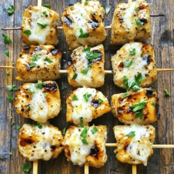 For these tasty grilled ranch garlic parmesan chicken skewers, you need: - 1.5 lbs boneless, skinless chicken breasts, cut into 1-inch cubes - 1/2 cup ranch dressing - 1 tablespoon garlic powder - 1/2 cup grated Parmesan cheese - 1 teaspoon black pepper - 1 teaspoon paprika - 1 tablespoon olive oil - 2 tablespoons fresh parsley, chopped (for garnish) - Skewers (wooden or metal) The key to these skewers is fresh chicken. I like boneless and skinless chicken breasts. They cook evenly and stay juicy. Ranch dressing gives a great flavor. It also helps the spices stick. Next, we need garlic powder. It adds a rich taste without overpowering the dish. I also use black pepper and paprika. These spices give a nice kick and color to the chicken. Finally, grated Parmesan cheese brings a creamy, salty touch. It's the finishing touch that makes these skewers special. Don't forget fresh parsley for garnish. It adds color and freshness. These ingredients work together to create a delightful dish. Each bite is full of flavor and satisfaction. Enjoy the process of making these skewers! First, gather your ingredients. You need ranch dressing, garlic powder, black pepper, and paprika. In a large bowl, mix these with olive oil. Stir until everything blends well. Then, add the cubed chicken. Make sure each piece is coated. This step helps the chicken soak up all the flavors. Cover the bowl with plastic wrap. Place it in the fridge for at least 30 minutes. If you have time, marinate for up to 2 hours. The longer it sits, the more taste it gains. If you use wooden skewers, soak them in water for 30 minutes. This prevents burning on the grill. If you use metal skewers, you can skip this step. Once the chicken is ready, it's time to assemble. Take the soaked skewers and thread the marinated chicken cubes onto them. Leave a little space between each piece. This helps them cook evenly. Now, preheat your grill to medium-high heat, around 400°F. Place the skewers on the grill. Cook for about 12-15 minutes. Turn them occasionally for even cooking. The chicken should reach an internal temperature of 165°F. When they are almost done, sprinkle grated Parmesan cheese on top. This step adds a rich, cheesy flavor. After grilling, remove the skewers and let them rest for a couple of minutes. Garnish with fresh parsley before serving. Enjoy! For the full recipe, check the Full Recipe section. Marinating the chicken is key to flavor. Start by mixing ranch dressing, garlic powder, black pepper, paprika, and olive oil. You want a nice blend. Make sure every chicken piece gets covered. Marinate for at least 30 minutes. If you let it sit longer, up to 2 hours, the taste gets even better. Keep it in the fridge for safety. To get those perfect grill marks, preheat your grill to medium-high heat. Aim for about 400°F or 200°C. Place the skewers on the grill, but don’t move them right away. Let them sit for about 4-5 minutes. This helps form those beautiful grill marks. After that, flip them to the other side for even cooking. Cook the skewers for about 12-15 minutes in total. Turn them occasionally to ensure even cooking. You want the chicken to reach an internal temperature of 165°F or 74°C. Use a meat thermometer for accuracy. In the last 2 minutes, sprinkle on the Parmesan cheese. This gives a nice finish to your skewers. For the full recipe, check the section above. {{image_2}} You can swap chicken for other proteins. Shrimp works well and cooks fast. Beef chunks also add rich flavor. Try using firm tofu for a plant-based twist. Just marinate it like chicken for the best taste. For a vegan or vegetarian option, use hearty vegetables. Bell peppers, zucchini, and mushrooms are great choices. You can also use tempeh or seitan. Marinate these like the chicken to keep the flavors strong. Want to kick up the flavor? Add spices like cayenne pepper for heat. A dash of lemon juice brightens the dish. Fresh herbs like thyme or rosemary can add depth. You can mix in different dressings too, like blue cheese or Caesar. These changes can make the skewers even more exciting. For the full recipe, check the section above. You can store leftover skewers easily. First, let them cool down. Place them in a shallow dish. Cover the dish with plastic wrap or use an airtight container. They can stay fresh in the fridge for up to 3 days. If you want to keep them longer, freezing is a good option. To reheat your skewers, use an oven for the best results. Preheat your oven to 350°F (175°C). Place the skewers on a baking sheet. Heat them for about 10-15 minutes. You can also use a microwave. Heat them for 1-2 minutes, but the oven gives better flavor. If you want to freeze the skewers, wrap them tightly in plastic wrap. Then, place them in a freezer bag. They can last up to 3 months in the freezer. When you're ready to eat them, thaw them in the fridge overnight. Then, reheat them using your preferred method. Enjoy those tasty flavors again! Check out the Full Recipe for more delicious tips. You should marinate the chicken for at least 30 minutes. This lets the flavors soak in. If you can, marinate for up to 2 hours for even more taste. The longer time makes the chicken juicier and more flavorful. These skewers pair well with many sides. Here are some tasty options: - Fresh green salad - Grilled vegetables - Rice or quinoa - Garlic bread - Creamy coleslaw These sides will add color and flavor to your meal. They make a great balance with the rich taste of the skewers. Yes, you can make these skewers in the oven. Preheat your oven to 400°F (200°C). Place the skewers on a baking sheet and cook for about 15-20 minutes. Turn them halfway through to get an even cook. You want the chicken to reach 165°F (74°C) for safety. The oven method gives you a nice option if grilling isn’t possible. In this blog post, we explored how to make delicious Grilled Ranch Garlic Parmesan Chicken Skewers. We covered essential ingredients like chicken and ranch dressing. I shared step-by-step instructions, including marinating and grilling tips. We also discussed variations for different diets and how to store leftovers. With the right ingredients and techniques, you can create a tasty meal. Don’t hesitate to experiment with flavors and share your results. Happy grilling!
