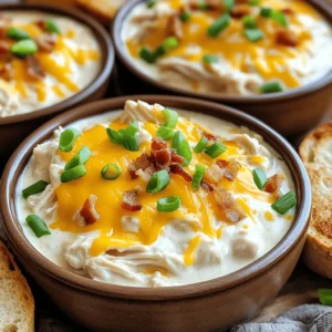 To make Crockpot Crack Chicken, gather these items: - 2 lbs boneless, skinless chicken breasts - 1 packet ranch dressing mix - 8 oz cream cheese, cubed - 1 cup chicken broth - 1 cup shredded cheddar cheese - ½ cup cooked crispy bacon bits (optional) - ¼ cup green onions, sliced - Salt and pepper to taste You will need a few tools for this recipe: - A crockpot - Measuring cups and spoons - Mixing spoons - Two forks (for shredding chicken) - A cutting board and knife If you want to change things up, try these options: - Chicken: Use thighs instead of breasts for more flavor. - Cream Cheese: Swap for Greek yogurt for a lighter option. - Cheese: Use pepper jack cheese for a spicy kick. - Bacon: Substitute turkey bacon for a healthier choice. - Ranch Mix: Make a homemade ranch mix using herbs and spices. These simple swaps can help you make the dish your own while keeping it delicious. Start by placing 2 lbs of boneless, skinless chicken breasts at the bottom of the crockpot. This is the base of your dish. Next, season the chicken with salt and pepper. Just a pinch of each will do. This will add great flavor to your meal. Now it’s time to add some deliciousness! Sprinkle 1 packet of ranch dressing mix evenly over the chicken. Then, pour in 1 cup of chicken broth. This adds moisture and flavor. Next, cube 8 oz of cream cheese and place it on top. Don’t stir yet; it will melt as it cooks. Cover the crockpot and set it to cook on low for 6-8 hours or high for 3-4 hours. You will know it's ready when the chicken is tender and easy to shred. After cooking, remove the chicken from the pot. Use two forks to shred it. This is a fun step! Return the shredded chicken back to the pot. Now, stir everything together until well mixed. It’s time to add 1 cup of shredded cheddar cheese and ½ cup of cooked crispy bacon bits, if you like. Stir until the cheese melts and everything is creamy. For a fresh touch, top with ¼ cup of sliced green onions. Serve in bowls with toasted bread or over rice. Enjoy your meal! For the complete recipe, check out the Full Recipe. One big mistake is not seasoning the chicken well. Always add salt and pepper to bring out the flavors. Another error is stirring too soon. If you mix before cooking, the cream cheese won’t melt right. Also, avoid overcooking. Chicken can dry out if left too long. Stick to the cooking times for juicy results. To boost the taste, try adding garlic powder or onion powder. These spices work well with ranch. You can also add a splash of hot sauce for a kick. If you like herbs, fresh parsley or dill can add brightness. Experiment with different cheeses too. Pepper jack or gouda can change the dish’s profile. Timing is key! If you use the low setting, cook for 6-8 hours. For the high setting, 3-4 hours is best. Check your chicken after the minimum time. If it shreds easily, it’s done. Always use a meat thermometer. The chicken should reach 165°F for safety. Enjoying it fresh is the best way to savor this meal. For the complete process, see the Full Recipe. {{image_2}} You can make Crockpot Crack Chicken lighter. Use lean chicken breast for less fat. Swap cream cheese for Greek yogurt. This change cuts calories and adds protein. Use low-sodium chicken broth to lower salt. You can also skip the bacon for a healthier dish. Try adding different herbs or spices. Mix in garlic powder for a nice kick. You can also use taco seasoning instead of ranch. This gives a fun twist to the dish. For a zesty touch, add lime juice. Fresh cilantro also brightens the flavor. Crockpot Crack Chicken shines when paired with sides. Serve it on a toasted bun for a tasty sandwich. It also works well over rice or pasta. For a fresh touch, add a side salad. You can even serve it with veggie sticks for crunch. Enjoy the creamy goodness with your favorite sides! Store leftover Crockpot Crack Chicken in an airtight container. Make sure it cools first. Place it in the fridge within two hours of cooking. It stays fresh for about three to four days. Always label the container with the date for easy tracking. If you see any signs of spoilage, toss it out. You can freeze Crockpot Crack Chicken for longer storage. Divide the dish into smaller portions. Use freezer-safe bags or containers to prevent freezer burn. Remove as much air as possible before sealing. It can last for up to three months in the freezer. When ready to eat, thaw it in the fridge overnight. To reheat, the best methods are the microwave or stovetop. If using the microwave, heat in short bursts. Stir in between to ensure even warming. On the stovetop, use low heat and add a splash of broth to keep it moist. Avoid overheating, as it can dry out the dish. Enjoy your meal just as much as the first time! Yes, you can use frozen chicken. Just add a bit more time to cook. If you use frozen chicken, it will take about 8-10 hours on low. This way, the chicken cooks fully and stays tender. To make it dairy-free, swap cream cheese with a dairy-free alternative. You can use cashew cream or a dairy-free cream cheese. Make sure to check that the ranch mix is dairy-free too. You can serve this dish in many ways! Here are some ideas: - Over rice: The creamy sauce pairs well with rice. - On toasted bread: Make a tasty sandwich or toast. - With veggies: Serve with a fresh salad or steamed veggies. - In a wrap: Use tortillas to make a fun wrap. Crockpot Crack Chicken can last about 3-4 days in the fridge. Store it in an airtight container. Make sure to let it cool before sealing it up. This blog post covered everything you need for Crockpot Crack Chicken. We explored the full ingredient list, essential kitchen tools, and useful substitutions. You learned the steps for preparing, cooking, and serving the dish. I shared tips to avoid mistakes, enhance flavors, and time your cooking perfectly. We also discussed variations, storage, and answered common questions. With these insights, you can enjoy a tasty meal the easy way. Cooking should be fun and rewarding. Now, go make your own Crockpot Crack Chicken and impress everyone!