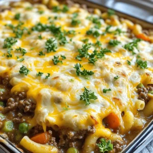 For this easy dish, you'll need these key ingredients: - 1 pound ground beef - 1 medium onion, diced - 2 garlic cloves, minced - 1 can (15 oz) diced tomatoes with green chilies - 2 cups frozen mixed vegetables (carrots, peas, corn) - 1 cup uncooked macaroni pasta - 2 cups beef broth - 1 tablespoon Worcestershire sauce - 1 teaspoon dried oregano - 1 teaspoon smoked paprika - Salt and pepper to taste - 1 cup shredded cheddar cheese - Fresh parsley, chopped (for garnish) These ingredients work together to create a warm, hearty meal. If you need a substitute for ground beef, try these options: - Ground turkey for a leaner choice - Ground chicken for a lighter flavor - Plant-based meat for a vegetarian option Each substitute changes the dish slightly, but they still taste great. Make sure you have these pantry staples on hand: - Dried oregano adds a nice herbal taste. - Smoked paprika gives warmth and depth. - Worcestershire sauce adds umami flavor to the mix. These staples enhance the flavor and make your casserole delicious. Start by gathering all your ingredients. You will need: - 1 pound ground beef - 1 medium onion, diced - 2 garlic cloves, minced - 1 can (15 oz) diced tomatoes with green chilies - 2 cups frozen mixed vegetables - 1 cup uncooked macaroni pasta - 2 cups beef broth - 1 tablespoon Worcestershire sauce - 1 teaspoon dried oregano - 1 teaspoon smoked paprika - Salt and pepper to taste - 1 cup shredded cheddar cheese - Fresh parsley, chopped Make sure to wash your hands and clean your workspace. This step makes cooking safe and fun. Dice the onion and mince the garlic. Measure your frozen vegetables, pasta, and broth. Having everything ready helps the cooking flow. Heat a large skillet over medium heat. Add the ground beef. Cook it for about 5-7 minutes, stirring until it’s browned. Drain any excess fat. This keeps your dish from being greasy. Next, add the diced onion and minced garlic to the skillet. Cook them for 3-4 minutes until the onion turns soft and clear. This adds great flavor. Then, stir in the diced tomatoes, frozen vegetables, uncooked macaroni, beef broth, Worcestershire sauce, oregano, smoked paprika, salt, and pepper. Mix everything well so each bite is tasty. Pour the beef mixture into a greased 9x13-inch casserole dish. Spread it out evenly. This helps it cook well. Cover the dish with foil and bake it in a preheated oven at 375°F (190°C) for 25 minutes. After 25 minutes, take off the foil. Sprinkle the shredded cheddar cheese on top. Put it back in the oven, uncovered, for 10-15 minutes. This melts the cheese and makes it bubbly. Once done, let the casserole sit for 5 minutes before serving. This cools it down a bit. Garnish with fresh parsley for a nice touch. Enjoy your meal! To enhance the flavor of your Hobo Ground Beef Casserole, use fresh ingredients. Fresh onions and garlic add a nice kick. You can also try adding herbs like thyme alongside oregano. A splash of hot sauce can give it some heat, if you like spice. Don't forget to taste as you cook. Adjust salt and pepper to your liking. Oven temperatures may vary. If your oven runs hot, check the casserole a bit early. It should be bubbly and golden on top. If your oven runs cool, you may need extra time. Always use an oven thermometer for the best results. Trust your eyes; the cheese should look melted and slightly crispy. For a lovely presentation, serve the casserole straight from the dish. Top with fresh parsley for a pop of color. Pair it with a side salad for freshness. You can also add garlic bread for a crunchy contrast. A dollop of sour cream on top can add creaminess and flavor. {{image_2}} You can make a tasty vegetarian hobo casserole easily. Just swap out the ground beef. Use one can of chickpeas or black beans instead. You can also add more veggies like bell peppers, zucchini, or spinach. This gives you protein and flavor. Replace beef broth with vegetable broth for a perfect flavor balance. To make this dish gluten-free, simply choose gluten-free pasta. Many brands offer great options. You can also check the broth and Worcestershire sauce for gluten. Some brands make gluten-free versions. This way, everyone can enjoy the meal without worry. Want to boost the flavor? Add some chopped bell peppers or mushrooms. You can also mix in some corn for sweetness. For heat, try adding jalapeños or crushed red pepper. If you love cheese, add more shredded cheddar or mix in pepper jack for spice. Each addition makes this dish unique and fun! To keep your leftover Hobo Ground Beef Casserole fresh, let it cool first. Place the casserole in an airtight container. Make sure to cover it tightly. Store it in the fridge for up to three days. If you want to save it longer, freezing is a great option. When you’re ready to eat the leftovers, preheat your oven to 350°F (175°C). Transfer the casserole to an oven-safe dish. Cover it with foil to keep it moist. Bake for about 20-25 minutes or until it’s hot all the way through. You can also reheat it in the microwave. Heat it in short bursts, stirring in between, until hot. To freeze your casserole, let it cool completely. Cut it into portions for easy serving. Wrap each portion tightly in plastic wrap. Place the wrapped portions in a freezer bag or container. Label with the date and type of dish. You can freeze it for up to three months. When you’re ready to eat, thaw it in the fridge overnight before reheating. Hobo Ground Beef Casserole lasts about 3 to 4 days in the fridge. To keep it fresh, put it in an airtight container. Make sure to let it cool down first before sealing it. This will help keep the moisture in and prevent sogginess. Always check for any signs of spoilage before eating leftovers. Yes, you can make this casserole ahead of time. You can assemble it and store it in the fridge for up to 24 hours before baking. Just cover it tightly with foil. When you are ready, bake it straight from the fridge. You may need to add a few extra minutes to the cooking time. This is great for busy days when you want a quick meal. Hobo Casserole works well with many sides. Here are some tasty ideas: - Green salad: A fresh salad adds crunch and balance. - Garlic bread: This is great for dipping into the casserole. - Steamed broccoli: Adds color and nutrition to your meal. - Coleslaw: A tangy slaw gives a nice contrast to the warm casserole. Feel free to mix and match to find your favorite pairings! Hobo Ground Beef Casserole is easy to make and full of flavor. We covered key ingredients, cooking steps, and useful tips. You can even switch ingredients for your needs. This dish is great for family meals or as leftovers. Storing and reheating are simple, too. With just a few changes, you can make it vegetarian or gluten-free. This recipe adapts well to your taste. Enjoy making it your own!