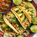 - 2 large chicken breasts, diced - 1 tablespoon olive oil - 1 teaspoon chili powder - 1 teaspoon cumin - 1 teaspoon garlic powder - 1 teaspoon onion powder - Salt and pepper to taste - 8 small corn tortillas - 1 cup shredded cabbage - 1 ripe avocado, sliced - ½ cup fresh cilantro, roughly chopped - 1 lime, cut into wedges - ½ cup salsa (store-bought or homemade) These ingredients create a simple yet tasty meal. The chicken breasts serve as the main protein. The olive oil keeps the chicken moist while cooking. To make these tacos burst with flavor, I use chili powder, cumin, garlic powder, and onion powder. These spices bring warmth and depth. They create that classic street food taste. The salt and pepper enhance the overall flavor. Adjust these to your liking for a personal touch. Garnishes can elevate your tacos. I recommend adding shredded cabbage for crunch. Avocado adds creaminess and richness. Fresh cilantro provides a bright finish. Lime wedges add a zesty kick. A drizzle of salsa ties everything together. You can mix and match toppings based on your taste. First, grab two large chicken breasts. Dice them into small, even pieces. This helps them cook properly. In a medium bowl, combine the diced chicken with olive oil. Add one teaspoon each of chili powder, cumin, garlic powder, onion powder, salt, and pepper. Mix everything well. Make sure the chicken is coated with the spices. Next, heat a skillet over medium-high heat. Add the seasoned chicken to the hot skillet. Cook the chicken for about 8 to 10 minutes. Stir it occasionally. Look for the chicken to turn white and firm. It should not be pink inside. Once it’s done, remove it from the heat. While the chicken cooks, warm up the corn tortillas. You can do this in a separate pan or in the microwave. Make sure they are soft and pliable. Now, let’s build our tacos! Take a warm tortilla and add a scoop of cooked chicken. Top it with a handful of shredded cabbage. Next, add a few slices of ripe avocado. Sprinkle fresh cilantro on top. Drizzle some salsa over everything. Finally, squeeze fresh lime juice for a burst of flavor. Repeat this process for the rest of the tortillas and ingredients. Enjoy your tasty tacos! To cook chicken well, start with quality chicken breasts. Cut them into small, even pieces. This helps them cook faster. Use a hot skillet for a good sear. Cook the chicken for about 8 to 10 minutes. Stir often to get even cooking. Check that it is no longer pink inside. If you have a meat thermometer, aim for 165°F. This ensures safety and juiciness. Warming tortillas makes them soft and tasty. You can use a pan or the microwave. For a pan, heat it on medium. Place a tortilla in the pan for about 30 seconds on each side. If using a microwave, wrap tortillas in a damp paper towel. Heat them for 20 to 30 seconds. This keeps them warm and pliable. To make your tacos look great, use a colorful platter. Stack the tacos neatly, leaving space for lime wedges. Add a small bowl of salsa for extra flavor. Fresh cilantro can be sprinkled on top for color. Serve the tacos with lime wedges for a zesty kick. This not only looks good but tastes great too! Enjoy your meal with family or friends. {{image_2}} You can swap chicken for other proteins in these tacos. Try diced beef or shrimp. Both options bring their own unique taste. Ground turkey is a lean choice. If you want something different, use pork. Each protein absorbs the spices well. Adjust the cooking time based on your choice. For a meatless option, use beans or lentils. Black beans work great for a hearty fill. You can also use grilled veggies like bell peppers or zucchini. Tofu is another tasty choice. Marinate it in the same spices for flavor. Top with your favorite garnishes for a fresh touch. Salsa is key for flavor. You can use store-bought or homemade salsa. Try a spicy mango salsa for a fruity kick. A zesty tomatillo salsa adds a tangy taste. If you like heat, add jalapeños or hot sauce. For creaminess, use a sour cream or avocado sauce. Mix and match these options for fun flavor. To store your leftover chicken tacos, place them in an airtight container. This keeps them fresh for up to three days in the fridge. Make sure the tacos are fully cooled before sealing them. If you store them while warm, moisture will build up. This can make the tortillas soggy. You can freeze the chicken for later. First, cool it completely. Then, pack it in a freezer-safe bag or container. Remove as much air as possible. Label the bag with the date. You can freeze the chicken for up to three months. However, tortillas do not freeze well. It's best to make fresh tortillas when you reheat. To reheat, you can use the microwave or a skillet. For the microwave, place the taco on a plate and heat for about 30 seconds. Check if it's warm enough; if not, add more time in 10-second bursts. For the skillet, warm it on medium heat for 2-3 minutes. Turn it often to avoid burning. Enjoy your tacos hot and fresh! Street-style tacos are small, soft tacos filled with tasty ingredients. They often use corn tortillas. You can find them at food trucks or street vendors. These tacos usually have a simple filling, like seasoned meats or veggies. Fresh toppings like cilantro, onions, and salsa add flavor. Street-style tacos are all about bold, vibrant flavors. To spice up your tacos, you can add more chili powder to the chicken. You can also use spicy salsa or fresh jalapeños. Try adding hot sauce on top for an extra kick. Another option is to mix in a little cayenne pepper with the spices. Adjust the heat to suit your taste. Yes, you can make the chicken ahead of time. Just cook the chicken as directed and let it cool. Store it in an airtight container in the fridge for up to three days. You can also freeze the chicken for up to three months. Just thaw it in the fridge before using. This way, you can enjoy quick and easy tacos any time! You learned about the key ingredients for tasty chicken tacos. We covered preparation, cooking steps, and assembly. Tips and tricks can help you cook perfectly. You can explore variations with different proteins or vegetarian options. We also discussed how to store leftovers and answered common questions. Remember, making tacos is fun and flexible. Enjoy experimenting with flavors to create your perfect dish!