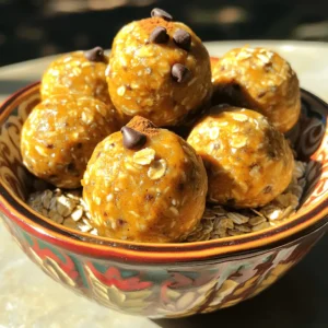 - 1 cup rolled oats - 1/2 cup almond butter (or peanut butter) - 1/2 cup pumpkin puree - 1/4 cup honey or maple syrup - 1/4 cup ground flaxseed - 2 teaspoons pumpkin spice seasoning - 1/2 teaspoon vanilla extract - 1/4 cup mini chocolate chips (optional) - Pinch of sea salt Each ingredient in these energy balls brings something special. - Rolled oats provide fiber and energy. They keep you full longer. - Almond butter adds healthy fats and protein. It helps build muscle. - Pumpkin puree is low in calories. It has vitamins A and C. - Honey or maple syrup gives natural sweetness. They are better than refined sugar. - Ground flaxseed is rich in omega-3 fatty acids. It supports heart health. - Pumpkin spice seasoning blends warm flavors. It adds a cozy touch. - Vanilla extract enhances sweetness. It makes the balls taste great. - Mini chocolate chips offer a fun treat. They can be skipped if you want less sugar. - Sea salt balances flavors. It makes everything taste better. You can swap some ingredients if needed. Here are some options. - Instead of almond butter, use peanut butter or sunflower seed butter. - If you want a vegan option, replace honey with agave syrup. - For a gluten-free version, ensure the rolled oats are certified gluten-free. - You can replace pumpkin puree with applesauce for a different taste. - To add crunch, try using chopped nuts in place of chocolate chips. These changes keep the energy balls tasty and healthy. Enjoy making your own version! To start, gather all your ingredients. You need rolled oats, almond butter, pumpkin puree, honey, ground flaxseed, pumpkin spice, vanilla extract, and mini chocolate chips if you want. In a large bowl, mix the rolled oats, almond butter, pumpkin puree, and honey or maple syrup. Stir until everything blends well. This step is key for a tasty base. Next, add the ground flaxseed, pumpkin spice, vanilla extract, and a pinch of sea salt. Mix again until all ingredients combine smoothly. The flaxseed adds fiber, and the pumpkin spice brings warmth to the flavor. If you love chocolate, now is the time to fold in the mini chocolate chips. They make the energy balls extra special. Use a sturdy spoon or spatula for mixing. This helps you combine the thick almond butter and pumpkin puree easily. If the mixture feels too dry, add a little more honey or pumpkin puree. If it's too wet, sprinkle in more oats or flaxseed. Taste your mixture! Adjust the sweetness or spice to your liking. Make sure to mix until no dry ingredients remain. This ensures each bite has great flavor. If you have kids helping, let them mix! It’s a fun way to get everyone involved. Once the mixture is ready, it’s time to roll the balls. Scoop about 1 tablespoon of the mixture using your hands. Roll it gently into a ball shape. Make sure the balls are firm, but not too tight. If they crumble, you may need to mix in a bit more almond butter or honey. Place each ball on a baking sheet lined with parchment paper. This prevents sticking. After shaping all the energy balls, chill them in the fridge for at least 30 minutes. Chilling helps them firm up and makes them easier to eat. Enjoy these tasty bites as a snack or breakfast on the go! To get the right texture for your energy balls, use rolled oats. They give a nice chewiness. The almond butter or peanut butter adds creaminess. Make sure your pumpkin puree is thick and not watery. If it feels too dry, add a bit more honey or maple syrup. If it seems too wet, add more oats or flaxseed. One common mistake is not chilling the balls long enough. They need at least 30 minutes in the fridge. This helps them firm up. Another mistake is not mixing well. Ensure all ingredients blend fully. If you skip the sea salt, you might miss out on flavor. Lastly, don’t skip the pumpkin spice. It gives that warm, cozy taste we love. For a fun presentation, place the energy balls in a bright bowl. You can sprinkle extra pumpkin spice on top for flair. These energy balls are great for snacks or a quick breakfast. Pair them with some fresh fruit or yogurt for a balanced meal. Enjoy them right away or store them in the fridge for later! {{image_2}} You can play with flavors in your energy balls. Try adding chocolate peanut butter for a rich twist. Just swap almond butter for chocolate peanut butter in the recipe. You could also mix in cinnamon raisin for a warm flavor. Just add some raisins and a bit more cinnamon. The options are fun and tasty! You can make these energy balls fit your diet too. For a vegan option, use maple syrup instead of honey. Almond butter is already plant-based, so you're all set there. If you want gluten-free, make sure to use certified gluten-free oats. This way, everyone can enjoy these yummy snacks! Boost the nutrition of your energy balls by adding superfoods. Consider mixing in protein powder for extra protein. A scoop of your favorite powder will work well. You can also add chia seeds for more fiber and omega-3s. Just a tablespoon will do the trick. These additions make your snack even healthier! To store your no-bake pumpkin spice energy balls, place them in an airtight container. This keeps them fresh and tasty. You can stack them in a single layer or add parchment paper between layers. This helps avoid sticking. If you want to freeze the energy balls, first chill them in the fridge. Once they firm up, place them in a freezer-safe container. They can last up to three months in the freezer. To thaw, just move them to the fridge overnight. You can also leave them at room temperature for a few hours. These energy balls stay fresh in the fridge for up to one week. For the best taste and texture, enjoy them within the first few days. Check for any changes in smell or texture before eating, just to be safe. Yes, you can. You can swap almond butter for peanut butter. Other options include cashew or sunflower seed butter. Each nut butter gives a unique taste. I find almond butter adds a nice creaminess. Peanut butter gives a classic flavor. These energy balls last about one week in the fridge. Store them in an airtight container. If you want them to last longer, freeze them. They can stay fresh for up to three months when frozen. Just let them thaw before you eat. Yes, these energy balls are gluten-free. Use certified gluten-free oats to be safe. All other ingredients are naturally gluten-free. This makes them a great snack for everyone. Enjoy without worry! You’ve learned how to make tasty no-bake pumpkin spice energy balls from scratch. We covered key ingredients and their benefits, plus tips for mixing and rolling. Remember to avoid common mistakes to get the best texture. You can play with flavors and substitute ingredients to fit your diet. Proper storage keeps them fresh longer. These snacks are easy, healthy, and full of energy. Now, it’s time to get in the kitchen and enjoy your new creation!