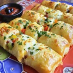 To create tasty low-cal pizza rolls, gather these key ingredients: - 1 cup whole wheat flour - 1 teaspoon baking powder - ¼ teaspoon salt - ½ cup Greek yogurt (nonfat) - ½ cup marinara sauce (low-sugar) - ½ cup shredded part-skim mozzarella cheese - ¼ cup diced bell peppers (any color) - ¼ cup sliced black olives - 1 teaspoon dried oregano - 1 teaspoon garlic powder - Cooking spray These ingredients form the base for your pizza rolls. Whole wheat flour gives a healthy twist. Greek yogurt replaces heavy fats and adds protein. Low-sugar marinara keeps it light. Mozzarella cheese adds rich flavor without too many calories. Bell peppers and olives bring color and crunch. - Whole wheat flour: This flour adds fiber and helps you feel full. It has more nutrients than white flour. - Baking powder: This helps the dough rise, making pizza rolls fluffy. - Salt: A small amount enhances the flavors. It keeps the dish balanced. - Greek yogurt: This is low in fat and high in protein. It gives the rolls a nice texture. - Marinara sauce: Low-sugar options cut down on calories, while still adding flavor. - Mozzarella cheese: Part-skim cheese lowers fat while keeping your rolls cheesy and delicious. - Bell peppers: These are full of vitamins and add a pop of color. - Black olives: They add healthy fats and a briny taste. - Dried oregano: This herb brings a classic pizza flavor. It also has antioxidants. - Garlic powder: This adds depth to your rolls without extra calories. Feel free to switch up the ingredients to match your taste: - Flour: Try almond flour or gluten-free flour for a different base. - Yogurt: Use low-fat sour cream if you like a tangy flavor. - Cheese: Swap mozzarella for cheddar or a dairy-free cheese. - Veggies: Add spinach, mushrooms, or zucchini for more nutrients. - Sauce: Experiment with pesto or a spicy sauce for a kick. These swaps can keep your low-cal pizza rolls fresh and exciting! Making low-cal pizza rolls is fun and simple. You need a few basic steps to get started. First, gather your ingredients. Preheat your oven to 400°F (200°C) while you mix your dough. This saves time and helps with baking. 1. In a mixing bowl, combine 1 cup whole wheat flour, 1 teaspoon baking powder, and ¼ teaspoon salt. Stir well to mix these dry ingredients. 2. Next, add ½ cup nonfat Greek yogurt to the bowl. Mix until a dough forms. 3. Knead the dough for a few minutes. It should feel smooth and soft. 4. On a floured surface, roll out the dough into a rectangle. Aim for about ¼ inch thick. 5. Spread ½ cup low-sugar marinara sauce over the dough. Leave a little space at the edges. 6. Sprinkle ½ cup shredded part-skim mozzarella cheese on top. Then add ¼ cup diced bell peppers and ¼ cup sliced black olives. 7. Add 1 teaspoon dried oregano and 1 teaspoon garlic powder for flavor. Spread them evenly. 8. Starting at one edge, roll the dough tightly into a log. Pinch the ends to seal it well. 9. Slice the log into bite-sized rolls, around 1-2 inches thick. Place them on a parchment-lined baking sheet. 10. Lightly spray the tops with cooking spray. This makes them golden. 11. Bake for 15-18 minutes. Look for a golden brown color to know they are done. 12. Let your pizza rolls cool for a few minutes before serving. - Use whole wheat flour for a healthy base. It adds fiber and taste. - Knead your dough well. This gives it a nice texture. - Roll the dough evenly. Aim for the same thickness throughout. - Don’t skip the resting time. It helps the dough relax, making it easier to roll. Following these steps will help you make delicious low-cal pizza rolls. Enjoy them with a side of marinara for dipping! When making low-cal pizza rolls, watch out for a few key errors. First, do not overwork the dough. This can make it tough. Knead the dough just enough to be smooth. Second, don’t skip the cooking spray. It helps your rolls get that nice golden color. Lastly, avoid using too much sauce. A thin layer works best, so the dough cooks evenly. To bake your pizza rolls evenly, use a lined baking sheet. This helps heat spread uniformly. Place the rolls apart on the sheet. Give them space; they expand as they bake. Preheat your oven fully before putting in the rolls. This step ensures they cook through and stay soft inside. Rotate the sheet halfway through baking for the best results. For a fun and tasty presentation, serve your pizza rolls on a bright platter. Add a small bowl of marinara sauce for dipping. You can also sprinkle fresh parsley on top for color. This makes the dish pop and look inviting. If you want to impress, add some colorful bell peppers around the rolls on the platter. This adds a nice touch and makes it even more appealing. {{image_2}} When making low-cal pizza rolls, you can play with the fillings. Try using different cheeses, like feta or cheddar. You can also swap the veggies. Think about adding spinach, mushrooms, or even artichokes. For meat lovers, turkey pepperoni or diced chicken works well too. Each filling adds a fun twist to the rolls. If you need a gluten-free option, use gluten-free flour. Almond flour or a store-bought blend will work great. This change keeps the rolls tasty while meeting dietary needs. Just make sure to check the flour’s baking instructions. Some gluten-free flours need more liquid. Adjust the yogurt or add a splash of water to get the right dough texture. For a vegetarian treat, simply skip the meat. Use extra veggies for a colorful mix. For a vegan version, replace the Greek yogurt with a plant-based yogurt. You can find good non-dairy cheese options too. These swaps keep the flavors bold and the rolls enjoyable for everyone. Don’t lose the taste; just change the ingredients! To keep your low-cal pizza rolls fresh, place them in an airtight container. You want to cool them first. Let them sit at room temperature for about 30 minutes. Then, cover them tightly and store in the fridge. They can last for up to three days. I always recommend using parchment paper between layers to prevent sticking. When you’re ready to enjoy the leftovers, reheating is simple. Preheat your oven to 350°F (175°C). Place the pizza rolls on a baking sheet. Heat for about 10-15 minutes or until they are warm. This method keeps them crispy. You can also use a microwave for quick reheating. Just microwave for 30 seconds to 1 minute, but they may turn soft. If you want to save some for later, freezing is a great option. Let the pizza rolls cool completely. Arrange them in a single layer on a baking sheet, then freeze for 1-2 hours. Once frozen, transfer them to a freezer bag. Make sure to remove as much air as possible. They can last in the freezer for up to three months. When ready to eat, bake them straight from the freezer, adding a few extra minutes to the cooking time. To add heat to your pizza rolls, try using spicy marinara sauce. You can also add red pepper flakes or diced jalapeños to the filling. Another option is to mix in some spicy sausage or pepperoni. These small changes will give your rolls a nice kick without adding too many calories. Yes, you can use various cheeses! For a sharp flavor, try using cheddar or pepper jack. If you want a creamier texture, you can add ricotta or cream cheese. Just keep in mind that different cheeses may change the overall taste and texture. Experiment to find your favorite combo. These pizza rolls pair well with many sides. A fresh garden salad makes a light and healthy option. You can also serve them with extra marinara sauce for dipping. If you enjoy crunch, try adding some carrot or celery sticks. These sides balance the richness of the rolls and add more flavor. This post shared how to make tasty and low-cal pizza rolls. We covered key ingredients, their benefits, and fun ways to customize your rolls. I provided easy steps for perfect dough and cooking. You learned about common mistakes and presentation ideas. We explored various filling options and ways to make them gluten-free or vegan. Finally, I detailed storage tips for leftovers. Now, you can create your own delicious pizza rolls any time! Enjoy experimenting with flavors and impressing your friends.