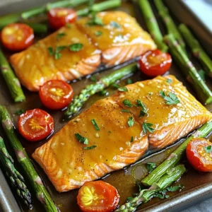- 4 salmon fillets (about 6 oz each) - 1/4 cup pure maple syrup - 2 tablespoons soy sauce - 1 tablespoon Dijon mustard - 1 tablespoon olive oil - 2 cups asparagus, trimmed - 2 cups cherry tomatoes, halved - 2 cloves garlic, minced - Salt and pepper to taste - Fresh parsley, chopped (for garnish) When cooking, quality matters. Choose fresh, wild-caught salmon for the best flavor. Look for bright, firm fillets. The skin should be shiny and moist. For veggies, select vibrant asparagus and ripe cherry tomatoes. Fresh herbs, like parsley, add a nice touch. Always use pure maple syrup, not the flavored kind. It enhances the glaze’s taste. You can swap salmon for another fish, like trout or cod. If you want a meatless option, try tofu instead. Use tamari if you need a gluten-free soy sauce. Dijon mustard can be replaced with whole grain mustard or honey mustard. For a lower-carb option, skip the glaze or use a sugar-free alternative. The veggies can change too. Try zucchini or bell peppers if you like. First, I set my oven to 400°F (200°C). This heat gives the salmon a nice cook. While it heats, I gather all my ingredients. I measure out 1/4 cup of pure maple syrup, 2 tablespoons of soy sauce, and 1 tablespoon of Dijon mustard. I also grab 1 tablespoon of olive oil. Next, I rinse 4 salmon fillets and place them on a baking sheet lined with parchment paper. I season them with salt and pepper. In a small bowl, I whisk together the maple syrup, soy sauce, Dijon mustard, and olive oil. I make sure to blend them well. The glaze smells sweet and tangy. I save half of this glaze for later. This way, I can drizzle it over the dish before serving. Now, I prepare the veggies. In a separate bowl, I toss 2 cups of trimmed asparagus and 2 cups of halved cherry tomatoes with 2 minced garlic cloves, salt, and pepper. I spread these veggies around the salmon on the baking sheet. I then brush each salmon fillet with the maple glaze. Once everything is on the baking sheet, I place it in the oven. I bake for about 12-15 minutes. I check for doneness by seeing if the salmon flakes easily with a fork. The veggies should look bright and tender. For a nice finish, I can broil the salmon and veggies for 2 minutes at the end. This adds a lovely caramelized look. Finally, I drizzle the reserved glaze over the salmon and veggies and garnish with fresh chopped parsley. To cook salmon perfectly, start with fresh fillets. Look for bright, moist flesh. The fillets should smell like the sea, not fishy. Preheat your oven to 400°F (200°C) for even cooking. Season the salmon with salt and pepper before applying the glaze. This will add a nice touch to the final flavor. Brush the salmon with the maple glaze generously. Bake it for 12 to 15 minutes. The salmon is done when it flakes easily with a fork. If you want a caramelized finish, broil it for the last two minutes. Fresh vegetables make a big difference in taste. For asparagus, look for bright green stalks. They should be firm, not limp. When choosing cherry tomatoes, pick ones that are shiny and firm. Avoid any with wrinkles or dark spots. Always buy seasonal veggies for the best flavor. This dish uses asparagus and cherry tomatoes, but feel free to mix in other fresh veggies you enjoy. Washing them before cooking keeps them clean and crisp. Herbs and spices can elevate your dish. Fresh parsley adds a pop of color and flavor. You can also try dill or basil for a different twist. Garlic is a must in this recipe, giving it depth. If you like heat, add a pinch of red pepper flakes. Remember to taste your glaze before cooking. Adjust sweetness or saltiness to match your preference. Simple tweaks, like adding lemon zest, can brighten the dish. {{image_2}} You can swap salmon for chicken or tofu. For chicken, use boneless, skinless breasts. The cooking time may change to about 20-25 minutes. For tofu, use firm or extra-firm types. Cut them into thick slices and marinate them in the glaze for about 15 minutes before cooking. The sweet glaze works well with both options, giving a rich flavor. Feel free to change the veggies. Broccoli, bell peppers, and zucchini work great. You can also try green beans or snap peas. Just remember to keep the cooking times similar. Each choice brings a unique taste and texture to the dish. Adding citrus can brighten the dish. Try squeezing fresh lemon or lime juice over the salmon and veggies. You can also add orange zest to the glaze. This extra layer of flavor pairs well with maple syrup. It makes the dish even more refreshing and delicious. After your meal, let the salmon and veggies cool first. Place leftovers in an airtight container. You can keep them in the fridge for up to three days. Make sure to store the glaze separately if you have any left. This helps keep everything fresh. To reheat, preheat your oven to 350°F (175°C). Place the salmon and veggies on a baking sheet. Cover them with foil to avoid drying out. Heat for about 10-12 minutes. If you like it crispy, you can broil them for the last two minutes. Always check the center to ensure it’s warm. If you want to freeze your leftovers, make sure they are completely cool. Wrap the salmon and veggies tightly in plastic wrap. Then, place them in a freezer-safe bag or container. They can last up to three months in the freezer. When you are ready to eat, thaw them in the fridge overnight before reheating. Yes, you can use salmon fillets with skin. The skin helps keep the fish moist and adds flavor. Cooking with the skin on can also make it easier to handle the fillets. When ready to serve, you can simply remove the skin if you prefer. Maple glazed salmon pairs well with many sides. Here are some great options: - Rice or quinoa for a hearty base. - Mashed potatoes or sweet potatoes for creaminess. - Fresh salad with greens and a light dressing. - Roasted or steamed vegetables like broccoli or carrots add color and nutrition. The salmon is done when it flakes easily with a fork. You can also check the internal temperature. It should reach 145°F (63°C). The flesh should look opaque and have a nice pink color. If you see this, it’s ready to enjoy! Cooking with the right ingredients is key to tasty meals. I shared steps to make maple-glazed salmon, including prep, glaze, and cooking techniques. Use fresh veggies and herbs to enhance flavors. You can also try variations with chicken or tofu. Store your leftovers well for quick meals later. For any questions, like how to tell when your salmon is done, refer to the FAQs. Enjoy your cooking journey and share your results!