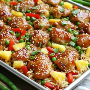 For this Sheet-Pan Teriyaki Chicken Pineapple Rice, you will need: - 1 lb boneless, skinless chicken thighs, cut into bite-sized pieces - 2 cups jasmine rice, rinsed - 2 cups low-sodium chicken broth - 1 cup fresh pineapple, diced - 1 red bell pepper, chopped - 1 cup sugar snap peas - 1/4 cup teriyaki sauce (store-bought or homemade) - 2 tablespoons soy sauce - 2 tablespoons olive oil - 2 cloves garlic, minced - 1 teaspoon ginger, minced - 2 green onions, sliced (for garnish) - Sesame seeds (for garnish) If you don’t have a specific ingredient, don’t worry! Here are some easy swaps: - Chicken thighs can be replaced with chicken breasts or tofu for a vegetarian option. - Jasmine rice can be swapped for basmati or brown rice, but cooking times may vary. - Fresh pineapple can be replaced with canned pineapple in juice for convenience. - Sugar snap peas can be changed to snow peas or green beans. To get the best taste, focus on these key ingredients: - Teriyaki Sauce: This adds a sweet and savory profile. You can use homemade for a fresher taste. - Fresh Pineapple: It brings brightness and sweetness that balances the dish well. - Garlic and Ginger: These ingredients give depth and warmth to the meal. Using these core items will help you create a dish that is both delicious and satisfying. Enjoy the vibrant flavors! Begin by cutting your chicken thighs into bite-sized pieces. This helps them cook evenly. In a large bowl, mix the chicken with teriyaki sauce, soy sauce, olive oil, garlic, and ginger. Toss the chicken well to coat it. Marinate the chicken for about 15 minutes. This step boosts flavor. Take a large rimmed baking sheet and spread the rinsed jasmine rice evenly across it. This rice will soak up all the tasty juices. Pour the chicken broth over the rice, ensuring it is fully covered. Next, place the marinated chicken pieces on top of the rice. Avoid stirring to keep the layers separate. Scatter the diced pineapple, chopped bell pepper, and sugar snap peas over the chicken. This adds color and nutrition. Cover the baking sheet tightly with foil. Preheat your oven to 400°F (200°C) and bake for 25-30 minutes. This allows the rice to become tender and the chicken to cook through. After baking, remove the foil and gently stir the mixture. This helps blend the flavors. Return the tray to the oven, uncovered, for another 10 minutes. This step gives a nice finish. Once done, let it sit for 5 minutes before serving. Garnish with sliced green onions and sesame seeds for a beautiful touch. Enjoy your meal! Marinating chicken adds depth to your dish. I recommend using teriyaki sauce, soy sauce, garlic, and ginger for a burst of flavor. Mix them in a bowl and toss the chicken pieces in the marinade. Let the chicken sit for about 15 minutes. This quick soak makes a big difference. The longer you marinate, the more flavor the chicken absorbs. Cooking jasmine rice is simple but key to this dish. Rinse the rice to remove excess starch. This helps the rice stay fluffy. Use low-sodium chicken broth instead of water for added flavor. The ratio is two cups of broth for every two cups of rice. Pour the broth over the rice on the baking sheet. This step ensures the rice cooks perfectly while absorbing all the flavors. The mix of sweet pineapple and savory teriyaki sauce creates a great balance. Don't forget to add veggies like bell pepper and sugar snap peas. They add crunch and color to your meal. If you want more sweetness, add extra pineapple. For a savory kick, drizzle more soy sauce. Taste as you go to find your perfect balance. {{image_2}} You can swap chicken for other proteins. Try shrimp or tofu for a change. Both options cook well and soak up flavors. Shrimp adds a sweet taste, while tofu gives a nice texture. Just remember to adjust cooking times. Shrimp cooks fast, so add it later in the baking process. Tofu can be marinated like chicken for more flavor. Feel free to mix in seasonal veggies. Broccoli, zucchini, or carrots can bring fresh tastes. Add these veggies when you bake the dish. They will cook perfectly with the chicken and rice. You can also use snap peas, as they add a nice crunch. The key is to keep the colors bright and flavors fresh. Rice is the base, but you can switch it up. Try brown rice for a nuttier taste. Quinoa works too, adding protein and a unique texture. Remember, different grains need different cooking times. Just follow the instructions on the package for the best results. This way, you can enjoy a new flavor twist in every bite. To keep your Sheet-Pan Teriyaki Chicken Pineapple Rice fresh, store it in an airtight container. This helps prevent moisture loss and keeps flavors intact. Make sure to cool the dish to room temperature first. Once cooled, seal it tightly and place it in the fridge. This dish stays good for about three to four days. When reheating, you want to keep the rice moist. Place your leftovers in a microwave-safe dish. Add a splash of chicken broth or water to keep it from drying out. Cover the dish with a lid or microwave-safe wrap. Heat it in the microwave for about two to three minutes, stirring halfway through. If you prefer the oven, heat it at 350°F (175°C) for about 15-20 minutes. Stir it occasionally to warm evenly. If you want to save some for later, freezing works well too. Allow the dish to cool completely, then divide it into portions. Use freezer-safe bags or containers for easy storage. Make sure to remove as much air as possible. Label with the date and freeze for up to three months. When ready to eat, thaw in the fridge overnight and reheat as mentioned above. This way, you can enjoy your tasty teriyaki chicken anytime! Yes, you can skip soy sauce. Instead, use coconut aminos or tamari for a gluten-free option. Both give a nice umami flavor. You might want to adjust the teriyaki sauce, as it can be salty. Test the taste as you go. Check the chicken for a safe internal temperature of 165°F (74°C). You can use a meat thermometer for this. The chicken should look white and juicy, not pink. If you don’t have a thermometer, cut a piece open. The juices should run clear, and the meat should not be rubbery. This dish is great on its own! You can add a side salad for crunch. A simple cucumber salad with rice vinegar is perfect. Feel free to serve extra teriyaki sauce for dipping. If you want more, steamed broccoli or sautéed bok choy can work well. Enjoy your meal! This blog post covered how to make delicious Sheet-Pan Teriyaki Chicken with Pineapple Rice. We explored key ingredients, cooking steps, and tips to enhance flavor. Remember, marinating adds taste, and using seasonal veggies keeps it fresh. You can switch proteins and rice for fun variations, too. By storing leftovers properly, you keep meals tasty longer. Enjoy your cooking and share your results!