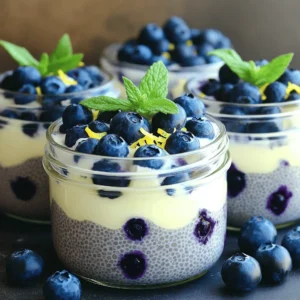 To make this tasty treat, gather the following main ingredients: - 1 cup almond milk (or any milk of choice) - 1/4 cup chia seeds - 2 tablespoons maple syrup (or honey) - Zest of 1 lemon - Juice of 1 lemon - 1 cup fresh blueberries (plus extra for topping) - 1/2 teaspoon vanilla extract - Pinch of sea salt These ingredients work together to create a creamy, tangy pudding. The chia seeds give it a nice texture. Almond milk keeps it light, while lemon adds a fresh burst of flavor. Feel free to add a few extra touches to make it your own: - Coconut milk for a richer taste - Other berries like strawberries or raspberries - A sprinkle of cinnamon or nutmeg for warmth - Yogurt for added creaminess - Sweeteners like agave or stevia for different flavors These optional ingredients let you play with flavors. You can also adjust sweetness to suit your taste buds. Blueberry lemon chia pudding is not just delicious; it's also healthy. Here’s a quick look at what’s in it: - Chia seeds provide fiber, protein, and omega-3 fatty acids. - Blueberries are full of antioxidants and vitamins. - Almond milk is low in calories and often fortified with nutrients. - Lemon juice adds vitamin C, which boosts your immune system. This pudding is a great snack or breakfast. It keeps you full and gives you energy throughout the day. Enjoy your healthy treat! First, gather all your ingredients. You need: - 1 cup almond milk (or any milk of choice) - 1/4 cup chia seeds - 2 tablespoons maple syrup (or honey) - Zest of 1 lemon - Juice of 1 lemon - 1 cup fresh blueberries (plus extra for topping) - 1/2 teaspoon vanilla extract - Pinch of sea salt In a mixing bowl, whisk together the almond milk, maple syrup, lemon zest, lemon juice, vanilla extract, and a pinch of sea salt. Make sure it mixes well. Next, slowly sprinkle the chia seeds into the mixture. Stir it slowly to avoid clumps. After that, gently fold in the fresh blueberries. Now it’s time to let it set. Cover your bowl with plastic wrap or split the mix into jars. Place it in the fridge for at least 4 hours. If you want it thicker, let it sit overnight. The chia seeds will absorb the liquid and create a nice pudding texture. When it’s set, stir it well. If it feels too thick, add a splash of almond milk. Serving this pudding is a fun part. Use clear glass jars to show off those beautiful layers. Top each serving with extra fresh blueberries and a sprinkle of lemon zest. For a touch of color, add a sprig of mint. This makes the dish look fresh and inviting. Enjoy your Blueberry Lemon Chia Pudding as a healthy snack or a tasty breakfast! To get the best texture for your pudding, use the right amount of chia seeds. The ratio of 1/4 cup of chia seeds to 1 cup of almond milk is key. When you mix the seeds into the liquid, stir well to avoid clumps. This helps the seeds absorb the milk evenly. If your pudding is too thick after setting, add a splash of almond milk. Mix it in well until you reach your desired creaminess. You can easily change the flavor of your pudding. Try swapping almond milk for coconut or oat milk. Both will add a unique taste. For sweetness, use honey or agave syrup instead of maple syrup. If you want a bolder lemon flavor, add more lemon zest or juice. You can also mix in spices like cinnamon or ginger for an extra kick. The options are endless! To ensure your chia pudding turns out great, always whisk the liquid ingredients first. Gradually add the chia seeds while stirring. This prevents clumping. Cover your bowl tightly or use jars for storage. Refrigerate for at least four hours, but overnight is best. This allows the seeds to fully expand and create that lovely pudding texture. Finally, serve in clear jars to show off the beautiful layers! {{image_2}} You can switch up the blueberries for other fruits. Try strawberries, raspberries, or peaches. Each fruit brings its own taste. For example, strawberries add sweetness. Raspberries lend a tart punch. Peaches give a soft, juicy flavor. Just chop the fruit small before mixing it in. You can also layer the fruits. This makes your pudding look colorful and fun. This recipe is easy to make dairy-free and vegan. Use almond milk or any plant milk you like. You can pick oat milk or coconut milk, too. These options keep the pudding creamy. Instead of maple syrup, use agave syrup for a vegan sweetener. You can also skip the honey if you want to keep it fully plant-based. This way, everyone can enjoy the treat. Want to change the taste? Try adding different flavors. A pinch of cinnamon or nutmeg can warm it up. You can also mix in cocoa powder for a chocolate twist. If you like spice, add a hint of ginger. For a tropical vibe, try coconut extract or a splash of pineapple juice. Each change makes the pudding new and exciting. Just remember to adjust the sweetness if needed. To store your blueberry lemon chia pudding, place it in an airtight container. You can use glass jars or any sealable bowl. Make sure to cover it well to keep it fresh. This pudding can stay good in the fridge for a few days. Always check for any changes in smell or texture before eating. Blueberry lemon chia pudding lasts up to five days in the fridge. For longer storage, you can freeze it. Pour the pudding into freezer-safe containers. Be sure to leave some space at the top, as it will expand when frozen. It can stay good in the freezer for about a month. When ready to eat, thaw it in the fridge overnight. You do not need to reheat chia pudding. It tastes best cold. If it seems too thick after storage, add a splash of almond milk. Stir well to get the right consistency before serving. Always top with fresh blueberries and a sprinkle of lemon zest for a bright touch. Enjoy the creamy texture and vibrant flavors even after storing! Chia seeds are tiny powerhouses of nutrition. They are high in fiber, which helps with digestion. They also contain omega-3 fatty acids, good for heart health. These seeds are full of protein, making them a great choice for energy. Plus, they have many vitamins and minerals like calcium and magnesium. Eating chia seeds can help keep you full and satisfied for longer. Yes, you can use frozen blueberries! They work well in this recipe. Just make sure to thaw them first. Thawed berries can be softer, but they still taste great. They will add flavor and color to your pudding. If you prefer, you can also blend them into the mixture for a smooth texture. You can store leftover chia pudding in the fridge for up to five days. Just keep it in an airtight container. If it thickens too much, add a little milk to loosen it. This way, you can enjoy it for breakfast or a snack later. Just remember to top it with fresh fruit before serving for a yummy touch! This blog post explores the fun and healthy world of blueberry lemon chia pudding. We covered main and optional ingredients, plus a nutritional overview. I provided step-by-step instructions for making and serving the pudding. Tips helped you achieve the perfect texture, while variations showed exciting ways to switch up flavors. Lastly, we discussed storage and answered common questions. Now, it's your turn to enjoy this tasty treat. Happy pudding-making!