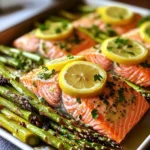 - 4 salmon fillets (about 6 oz each) - 1 bunch of asparagus, trimmed - 3 tablespoons olive oil - 2 tablespoons fresh lemon juice - Zest of 1 lemon - 2 cloves garlic, minced - 1 teaspoon dried oregano - 1 teaspoon fresh thyme leaves - Salt and pepper, to taste - Lemon slices for garnish - Fresh parsley, chopped (optional for garnish) To create this dish, gather your ingredients first. Fresh salmon fillets are the star. They should be about 6 ounces each, perfect for a filling meal. Next, you'll want a bunch of asparagus. Trim the ends to keep them tender. Olive oil adds a rich flavor. It also helps the herbs stick to the fish and veggies. Fresh lemon juice and zest bring brightness. This zest is key; it gives a burst of flavor. Garlic adds depth. Minced garlic infuses the dish with its warm taste. Dried oregano and fresh thyme give an earthy note. Don't forget salt and pepper. They enhance all the flavors. Lemon slices work well as a garnish. They add a pop of color and a fresh smell. If you like, sprinkle some fresh parsley on top. This adds a nice touch. With these ingredients, you’ll create a lovely meal that is simple yet full of flavor. Start by preheating your oven to 400°F (200°C). This high heat helps cook the salmon and asparagus well. Next, grab a large baking sheet. Line it with parchment paper to make cleanup easy. This step keeps the fish and veggies from sticking. Now it’s time to mix the lemon herb marinade. In a small bowl, add 3 tablespoons of olive oil. Squeeze in 2 tablespoons of fresh lemon juice. Then, add the zest of 1 lemon for extra flavor. Mince 2 cloves of garlic and toss them in too. Sprinkle in 1 teaspoon of dried oregano and 1 teaspoon of fresh thyme leaves. Finally, add salt and pepper to taste. Whisk everything together until it’s smooth and well combined. Next, we’ll assemble the salmon and asparagus on the baking sheet. Place 4 salmon fillets on one side of the sheet. Make sure they have some space between them. Brush half of the lemon herb mixture over the salmon fillets. On the other side, arrange the asparagus in a single layer. Make sure each stalk is nice and even. Drizzle the rest of the lemon herb mixture over the asparagus. Toss the asparagus gently to coat it well. Now, place the sheet pan in the oven. Bake for 15-20 minutes. The salmon should flake easily with a fork when done. The asparagus should be tender but still crisp. Once cooked, carefully take the pan out of the oven. Let it rest for a couple of minutes. For a pretty touch, garnish with fresh lemon slices and chopped parsley if you like. Enjoy your meal! To get perfectly cooked salmon, start with fresh fillets. Look for bright color and a clean smell. Preheat your oven to 400°F (200°C) for even cooking. Brush the salmon with the lemon herb mix before baking. Bake for 15-20 minutes. The salmon is done when it flakes easily with a fork. Use a meat thermometer if you want to be precise. Aim for an internal temperature of 145°F (63°C). When cooking asparagus, fresh is best. Choose firm stalks with bright green color. Trim the ends to remove any tough parts. Toss the asparagus in the lemon herb mixture. This adds flavor and helps it cook nicely. Spread the asparagus on the baking sheet in a single layer. This helps it roast evenly. Bake alongside the salmon for about 15-20 minutes. The asparagus should be tender yet still crisp. You can easily change the flavors in this dish. Try adding different herbs like dill or basil. You can also swap lemon juice for lime juice for a fresh twist. For a spicy kick, add a pinch of red pepper flakes. Experiment with different oils too. Avocado oil or sesame oil can add a unique taste. Feel free to mix and match to find your favorite combination! {{image_2}} If you want a change from salmon, try these options. Chicken breasts work great. They soak up the lemon herb flavors well. Shrimp also cooks fast and adds a nice twist. For a meatier taste, consider using pork tenderloin. Cut it into even pieces to ensure even cooking. Switch up the asparagus with your favorite veggies. Broccoli or green beans are good choices. Zucchini adds a nice texture too. Bell peppers give a sweet crunch. Mix in cherry tomatoes for a pop of color. Remember to adjust cooking time for softer veggies. This recipe is naturally gluten-free. Check your olive oil for purity to be safe. All the ingredients used are dairy-free, so you can enjoy it without worry. If you want a creamy element, use avocado slices on the side. This keeps it fresh and tasty. After enjoying your meal, let the leftovers cool. Place salmon and asparagus in an airtight container. You can store them in the fridge for up to three days. Make sure to cover them well to keep flavors fresh. To reheat, preheat your oven to 350°F (175°C). Place the salmon and asparagus on a baking sheet. Cover them with foil to keep moisture in. Heat for about 10-15 minutes or until warm. You can also use a microwave. Just heat in short bursts, checking often. You can freeze your leftovers too! Wrap the salmon and asparagus tightly in plastic wrap. Then, place them in a freezer bag. They can last up to three months in the freezer. To eat, simply thaw in the fridge overnight before reheating. Yes, you can use frozen salmon. Just make sure to thaw it first. Thaw salmon in the fridge overnight or under cold water. Once thawed, pat it dry. This helps the lemon herb mix stick better. I love to serve this dish with rice or quinoa. They soak up the lemon flavor well. A fresh salad also pairs nicely. Try a simple green salad or even a fruit salad. You can also serve crusty bread to soak up the juices. Check the salmon for color and texture. It should be a light pink and flake easily with a fork. You can also use a food thermometer. The internal temperature should reach 145°F (63°C). If you see white albumin on the surface, it is done. This is just protein and not harmful. This blog post covered a simple and tasty recipe for lemon herb salmon and asparagus. We discussed the key ingredients, the step-by-step cooking process, and helpful tips for perfect results. I shared easy variations and storage details for your leftovers too. Cooking can be fun and rewarding, even for beginners. Experiment with flavors and make this meal your own. Enjoy your cooking journey and share your experiences!