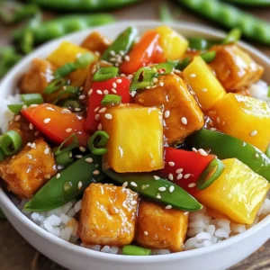 - 1 block of firm tofu, pressed and cubed - 1 cup bell peppers (red, yellow, and green), sliced - 1 cup snap peas, trimmed - 1 cup pineapple chunks (fresh or canned, drained) Tofu is the star of this dish. I love using firm tofu because it holds its shape well. Pressing it removes extra moisture, making it perfect for frying. Bell peppers add color and crunch. Snap peas bring a fresh, sweet bite. Pineapple chunks give a lovely sweetness to balance the flavors. - 2 tablespoons cornstarch - 2 tablespoons vegetable oil - 1/4 cup soy sauce - 1/4 cup rice vinegar - 1/4 cup brown sugar Cornstarch is key for crispy tofu. It coats the tofu and helps it fry up nice and golden. Vegetable oil is great for frying because it has a high smoke point. Soy sauce gives a salty depth. Rice vinegar adds a tangy kick, while brown sugar brings the sweetness for that classic sweet and sour taste. - 1 tablespoon fresh ginger, minced - 2 garlic cloves, minced - 1 teaspoon sesame oil - 2 green onions, chopped (for garnish) - Sesame seeds (for garnish) Fresh ginger and garlic add a powerful aroma. The sesame oil gives a rich flavor. Green onions add a fresh crunch, while sesame seeds offer a nice texture on top. These garnishes make the dish pop and enhance the overall taste. To start, I press the tofu. This helps to remove extra moisture. I usually press it for at least 30 minutes. I place a heavy object on top to speed up the process. After pressing, I cut the tofu into bite-sized cubes. This size helps the tofu cook well. Next, I coat the tofu cubes with cornstarch. I toss them in a bowl until they are evenly covered. The cornstarch makes the tofu crispy when I cook it. Crispy tofu brings great texture to the dish. Now, I heat vegetable oil in a large non-stick skillet. I set the heat to medium-high. Once the oil is hot, I carefully add the tofu cubes. I fry them until they turn golden brown, which takes about 8-10 minutes. I turn them occasionally to cook all sides evenly. After frying, I remove the tofu from the skillet and set it aside. In the same skillet, I add sliced bell peppers and snap peas. I stir-fry them for about 3-4 minutes. I want them to be vibrant and slightly tender. Timing is key here. I wait until the last minute to add pineapple chunks. This way, they warm up without getting mushy. While the veggies cook, I make the sweet and sour sauce. In a bowl, I whisk together soy sauce, rice vinegar, brown sugar, fresh ginger, garlic, and sesame oil. This mix brings a nice balance of flavors. After that, I return the tofu to the skillet with the vegetables. I pour the sauce over everything and gently toss to coat. I cook it for an extra 2-3 minutes until everything is heated through. Finally, I add the pineapple and stir for just a minute. Now, my sweet and sour tofu bowl is ready to serve over cooked rice or quinoa. I love to garnish it with chopped green onions and sesame seeds for that extra touch! To make crispy tofu, start by pressing it well. I press my tofu for at least 30 minutes. This removes extra moisture. Less moisture means crispier tofu. After pressing, cut the tofu into bite-sized cubes. Next, coat the tofu with cornstarch. Use about 2 tablespoons of cornstarch. Make sure each piece is evenly coated. A good coating helps achieve a golden, crunchy texture when cooking. To boost the flavor, I suggest adding spices and herbs. Try garlic powder or onion powder for depth. You can also use a pinch of red pepper flakes for heat. Adjust the sweetness and acidity to fit your taste. If you like it sweeter, add a touch more brown sugar. For a tangier kick, increase the rice vinegar. Taste as you go to find the right balance. When serving sweet and sour tofu bowls, consider side dishes like steamed broccoli or a fresh salad. These add color and crunch. For a hearty base, pair the tofu with cooked rice or quinoa. Both options soak up the sauce nicely. You can also try brown rice for added fiber. Enjoy the mix of textures and flavors! {{image_2}} You can change the protein in sweet and sour tofu bowls. If you want a different option, try chickpeas or tempeh. They both add texture and flavor. You can use cooked chickpeas for a nutty taste. Tempeh gives a hearty bite. For non-vegetarians, you can add shrimp or chicken. Shrimp cooks quickly and adds a nice seafood flavor. Chicken can be grilled or cooked in the skillet. Just make sure it's cooked through. Feel free to switch up the veggies. You can use broccoli, carrots, or zucchini. These vegetables add color and crunch. Seasonal veggies are great too. In summer, use fresh corn or tomatoes. In winter, try root vegetables like sweet potatoes. You can adjust the sauce to fit your taste. If you like it sweeter, add more brown sugar. For more tang, increase the rice vinegar. Taste as you go to find your perfect balance. If you need a vegan sauce, swap honey for maple syrup. This keeps it plant-based while still being sweet. Store your sweet and sour tofu in a container with a tight lid. This keeps it fresh. Let it cool before sealing. The tofu can last in the fridge for up to four days. If you have rice or quinoa, keep them separate. This helps maintain texture. Yes, you can freeze sweet and sour tofu. However, tofu changes texture when frozen. To freeze, place the tofu in a freezer-safe bag. Remove as much air as you can. This helps prevent freezer burn. You can freeze it for up to three months. To reheat, use an oven or a skillet. If you use an oven, preheat it to 350°F. Place the tofu on a baking sheet. Bake for about 15 minutes or until heated through. If you use a skillet, heat some oil over medium heat. Add the tofu and stir gently. To keep the tofu crispy, avoid using a microwave. Yes, you can use different types of tofu. Firm tofu works best for this dish. It holds its shape well during cooking. Soft tofu can break apart easily. If you want a creamier texture, use silken tofu. However, it may not hold up well in bowls. For the best results, stick with firm tofu. To make this dish gluten-free, swap the soy sauce. Use tamari sauce instead. Tamari is a gluten-free soy sauce. You can also try coconut aminos. This option has less salt and is gluten-free. Both will add flavor without the gluten. This dish can last in the fridge for about three days. Store it in an airtight container. Make sure it cools down before sealing. When reheating, add a splash of water to keep it moist. Enjoy your tasty leftovers within those three days for the best flavor! In this blog, we explored making a tasty sweet and sour tofu dish. We covered main ingredients, cooking steps, and tips for success. I shared ways to enhance flavors and variations to try. Remember, pressing tofu well is key for crispness. You can customize the recipe with your favorite veggies or proteins. Enjoy this meal with rice or quinoa for a complete dish. Happy cooking!