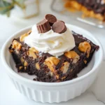 To make your Peanut Butter Cup Dump Cake, gather these key items: - 1 box of chocolate cake mix - 1 cup creamy peanut butter - 1 cup milk - 1 cup semi-sweet chocolate chips - 1 cup chopped Reese's Peanut Butter Cups - 1 cup vegetable oil - 4 large eggs - ½ teaspoon vanilla extract - Optional: Whipped cream for serving These ingredients create a sweet and rich cake that everyone will love. You can add extra flavors to your cake. Here are some fun options: - ½ cup chopped nuts for crunch - 1 teaspoon coffee powder to enhance chocolate flavor - ½ cup caramel sauce for a sweet twist These additions can give your cake a unique taste. If you can’t find an ingredient, don’t worry! Here are some swaps: - Use almond butter instead of peanut butter. - Swap whole milk for almond or oat milk. - Replace vegetable oil with melted coconut oil. These substitutions work well and keep the cake yummy. {{ingredient_image_1}} 1. Preheat the Oven: Start by heating your oven to 350°F (175°C). Grease a 9x13-inch baking dish with cooking spray. This keeps the cake from sticking. 2. Mix the Wet Ingredients: In a large bowl, combine 1 cup of creamy peanut butter, 1 cup of milk, 1 cup of vegetable oil, 4 large eggs, and ½ teaspoon of vanilla extract. Use a whisk or mixer until it is smooth and creamy. 3. Add the Dry Ingredients: Gradually add the box of chocolate cake mix to the wet mix. Stir until just combined. You want to avoid lumps but do not overmix. 4. Create the Dump Layer: Pour the mixed batter into the prepared baking dish. Spread it evenly across the dish. 5. Add the Toppings: Sprinkle 1 cup of semi-sweet chocolate chips and 1 cup of chopped Reese's Peanut Butter Cups over the top. Gently press them into the batter. This helps them sink during baking. 6. Bake the Cake: Place the baking dish in the oven. Bake for 30-35 minutes. Check with a toothpick. It should come out clean or with a few moist crumbs. 7. Cool and Serve: Once baked, remove the cake from the oven. Let it cool in the dish for 10-15 minutes. Cut into squares and serve warm. For extra creaminess, top with whipped cream. 8. Presentation Tips: Serve the cake in a bowl. Add a dollop of whipped cream and sprinkle more chocolate chips or chopped peanut butter cups on top for a nice finish. To make your Peanut Butter Cup Dump Cake great, follow these tips: - Use fresh ingredients: Always check the dates on cake mix and eggs. - Mix well, but not too much: Stir until just combined to keep it light. - Grease the pan well: Use cooking spray to prevent sticking. - Press toppings in gently: This helps them sink and blend with the cake. Avoid these common mistakes for the best dump cake: - Overmixing the batter: This can make your cake dense and tough. - Skipping the cooling step: Letting it cool helps set the cake for easy cutting. - Not testing for doneness: Use a toothpick to ensure it’s baked all the way through. - Adding too many toppings: More isn’t always better; a good balance is key. Serve your dump cake with these ideas: - Top with whipped cream: This adds creaminess and makes it extra special. - Garnish with extra chocolate chips: A sprinkle on top looks nice and tasty. - Pair with vanilla ice cream: The cold ice cream contrasts well with the warm cake. - Serve in dessert bowls: This makes it easy for guests to enjoy every bite. Pro Tips Use Room Temperature Ingredients: Ensure your eggs and milk are at room temperature for a smoother batter and better rise. Don’t Overmix: Stir until just combined to keep the cake light and fluffy. Overmixing can lead to a dense texture. Customize Your Toppings: Feel free to add other mix-ins like nuts or different types of chocolate for a unique twist! Cool Before Serving: Let the cake cool for at least 10-15 minutes before serving to help it set and make slicing easier. {{image_2}} To make a gluten-free version of this dump cake, you can swap the chocolate cake mix. Use a gluten-free chocolate cake mix instead. Check the label to ensure it’s truly gluten-free. The rest of the recipe stays the same. This way, everyone can enjoy this tasty treat without worry. You can add fun flavors and textures to your cake. Consider using chopped nuts like pecans or walnuts. You can also mix in some crushed Oreos or chocolate sandwich cookies. For a twist, try adding a swirl of caramel sauce or a sprinkle of sea salt on top. Each mix-in adds something special to the cake. If you want to serve the cake cold, let it cool completely. Then, cover it and place it in the fridge for a few hours. This makes the cake firmer and easier to cut. A cold slice is perfect for warm days. Serve it with whipped cream or a scoop of ice cream for a fun treat. To store leftover Peanut Butter Cup Dump Cake, let it cool completely. Then, cut the cake into squares. Place the squares in an airtight container. You can keep it in the fridge for up to five days. This keeps the cake moist and fresh. To reheat the cake, take a square from the fridge. Place it on a microwave-safe plate. Heat it for about 20 to 30 seconds. Check to see if it is warm. You can also reheat it in the oven. Preheat your oven to 350°F (175°C). Place the cake on a baking sheet for about 10 minutes. This will keep the cake soft. You can freeze Peanut Butter Cup Dump Cake too! Wrap each square tightly in plastic wrap. Then, place them in a freezer bag. Make sure to squeeze out any air. This helps keep the cake fresh for up to three months. When ready to eat, move the cake to the fridge overnight. Then, reheat it as mentioned above. Enjoy the delightful cake at any time! Yes, you can make this recipe ahead of time. Prepare the batter and place it in the baking dish. Cover it with plastic wrap and store it in the fridge for up to 24 hours. When you are ready, bake it straight from the fridge. Just add a few extra minutes to the baking time. To check if the cake is fully baked, use a toothpick. Insert it into the center of the cake. If it comes out clean or with a few moist crumbs, the cake is done. If it has wet batter on the toothpick, bake it for a few more minutes. Keep an eye on it to avoid overbaking. Yes, you can use different types of candy. Try adding M&Ms, Snickers, or chocolate chunks. Get creative with your favorite candies. Just keep the amounts the same to ensure the cake bakes properly. You will have a fun and unique flavor each time! This blog post covered everything you need to know about making a dump cake. We talked about the key ingredients, steps for baking, and tips for perfect results. I shared fun variations and how to store leftovers. Remember, easy substitutions can make your cake unique. Avoid common mistakes for the best taste. Embrace your creativity with mix-ins. Enjoy serving this delightful dessert hot or cold. Now, you have all the tools to bake a delicious dump cake! Happy baking!