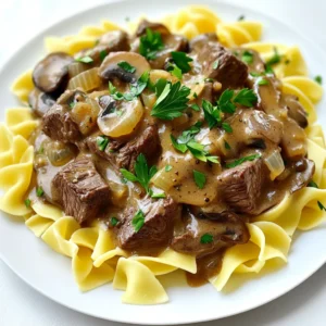- 2 pounds beef chuck, cut into 1-inch cubes - 1 medium onion, chopped - 3 cloves garlic, minced - 8 ounces mushrooms, sliced To make a great beef stroganoff, you need the best beef chuck. It has flavor and tenderness. Cut it into 1-inch cubes for even cooking. Next, use one medium onion, chopped finely. This adds sweetness and depth. Don’t forget the garlic! Three minced cloves bring a warm aroma. Lastly, use eight ounces of sliced mushrooms. They add a lovely texture and richness. - 1 cup beef broth - 1 tablespoon Worcestershire sauce - 1 teaspoon dried thyme - 1 teaspoon paprika - 1/2 teaspoon black pepper For taste, beef broth is key. Use one cup for a savory base. Add a tablespoon of Worcestershire sauce for a tangy kick. Season with one teaspoon of dried thyme and one teaspoon of paprika for that depth of flavor. A half teaspoon of black pepper gives it a little heat. - 1 cup sour cream - 3 tablespoons all-purpose flour - Salt to taste To make it creamy, you’ll need one cup of sour cream. This gives a rich, smooth texture. Use three tablespoons of all-purpose flour to help thicken the sauce. Lastly, don’t forget the salt! Adjust it to your taste. Start by searing the beef cubes. Heat olive oil in a large skillet over medium-high heat. Add the beef cubes and season them with salt and pepper. Sear the beef until it turns brown on all sides, which takes about 5 minutes. Once browned, transfer the beef to the slow cooker. Next, it's time to cook the vegetables. In the same skillet, add the chopped onion and minced garlic. Sauté these for 2-3 minutes until they soften. Then, add the sliced mushrooms and cook for an additional 3-4 minutes. Once done, transfer the vegetable mix to the slow cooker with the beef. Now, mix everything together. Pour in the beef broth, Worcestershire sauce, dried thyme, and paprika. Stir to combine all the ingredients. Cover the slow cooker and set it to cook on low for 7-8 hours or on high for 4-5 hours. The beef should be tender when it’s ready. About 30 minutes before serving, we will thicken the sauce. In a small bowl, whisk together the sour cream and flour until smooth. Gradually stir this mixture into the slow cooker. This will help thicken the sauce. Taste and adjust seasoning with more salt and pepper if needed. While your stroganoff cooks, prepare your egg noodles or rice. Follow the package instructions to cook them. Serve the beef stroganoff over the noodles or rice. Don’t forget to garnish with fresh parsley for a nice touch! For beef stroganoff, the best cut is beef chuck. It is tough but becomes tender when cooked slowly. Beef chuck has a rich flavor, which makes your dish taste great. This cut is also budget-friendly, so it's a win-win for cooks. To boost flavor, consider adding a few extra seasonings. Try a pinch of garlic powder or some fresh herbs like thyme and rosemary for extra taste. You can also serve your stroganoff with egg noodles or rice. These sides soak up the sauce and make every bite delicious. To achieve the right sauce consistency, stir in the sour cream and flour mixture slowly. This keeps the sauce smooth. A common mistake is adding the sour cream too early, which can curdle. Always wait until the end of cooking to thicken the sauce. {{image_2}} You can switch out the mushrooms to change the flavor. Try using shiitake or portobello mushrooms. Each type adds its own taste and texture. You can also mix in other veggies like carrots or bell peppers. They will add color and nutrition to your dish. If you want something different, swap the beef for chicken or turkey. Both work well and keep the dish tasty. For a vegetarian option, use mushrooms and add lentils. This keeps the dish hearty without meat. To make this recipe gluten-free, use gluten-free flour instead of all-purpose flour. You can also serve the stroganoff over zoodles or rice. These options taste great and fit gluten-free diets perfectly. To store leftovers, let the beef stroganoff cool to room temperature. Then, place it in an airtight container. This helps keep the flavors fresh. I suggest using glass or BPA-free plastic containers. These containers are great for keeping food safe and tasty. For freezing stroganoff, first let it cool. Then, place the stroganoff in a freezer-safe container. Be sure to leave some space at the top for expansion. When you are ready to eat, thaw the stroganoff in the fridge overnight. To reheat, warm it on the stove or in the microwave. Stir well to ensure even heating. In the fridge, beef stroganoff lasts about 3 to 4 days. If you freeze it, it can last for up to 3 months. Look for signs of spoilage like a sour smell or a change in color. If you notice these signs, it's best to discard the stroganoff. Always trust your senses when checking food safety. To make this dish, you need about 15 minutes for prep. Then, slow cook it for 7-8 hours on low or 4-5 hours on high. So, the total time is around 8 hours and 15 minutes. This long cooking time lets the beef get very tender and tasty. You can use frozen beef, but it may change the cooking time. If you use frozen beef, add an extra hour to your cooking time. The beef may not brown as nicely as fresh beef. If you can, thaw the beef first for best results. To thicken the sauce, mix sour cream and flour in a bowl. Make sure it is smooth. Stir this mix into the slow cooker about 30 minutes before serving. This will help the sauce get nice and creamy. You can adjust the seasoning with salt and pepper to your taste. This blog post covered how to make Slow Cooker Beef Stroganoff. You learned about the main ingredients like beef chuck, onions, and mushrooms. We explored seasonings and creamy components that build flavor and texture. I provided step-by-step instructions, along with helpful tips, variations, and storage info. Mastering this dish will impress anyone at your table. Enjoy making it your own with our suggestions. Cooking is fun, so don’t hesitate to experiment!