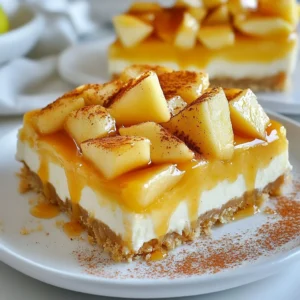 - 1 cup graham cracker crumbs - 1/4 cup sugar - 1/2 cup unsalted butter, melted - 2 (8 oz) packages cream cheese, softened - 1/2 cup sugar - 1 teaspoon vanilla extract - 2 large eggs - 2 cups diced apples (preferably Granny Smith) - 1 teaspoon cinnamon - 1/4 teaspoon nutmeg - 1 cup caramel sauce (plus extra for drizzling) Use a standard measuring cup for the graham crackers and sugar. For butter, melt it in a microwave or stove until it’s liquid. Cream cheese should be soft but not warm, making it easier to mix. Diced apples should be about half an inch in size. This keeps them tender but not mushy when baked. - Graham Crackers: You can swap these for crushed cookies, like vanilla wafers or Oreos, for a different flavor. - Apples: Try using different apple varieties like Honeycrisp or Fuji for added sweetness. - Sweetener: You can use brown sugar instead of white sugar for a deeper flavor. - Spices: Add a pinch of cloves for extra warmth and depth to the flavor. - Caramel Sauce: Consider making your own caramel sauce for a richer taste, or use a store-bought version for convenience. These variations can change the taste and texture while still keeping the bars delicious and fun! {{ingredient_image_1}} Start by preheating your oven to 325°F (160°C). Grab an 8x8 inch baking pan. Line it with parchment paper, leaving some paper hanging over the edges. This will help you lift the bars out later. In a bowl, mix 1 cup of graham cracker crumbs, 1/4 cup of sugar, and 1/2 cup of melted unsalted butter. Stir the mixture until it is well combined. Press this mixture firmly into the bottom of your lined baking pan. Make sure it forms an even layer. In a large bowl, beat together two packages of softened cream cheese and 1/2 cup of sugar. You want this mixture to be smooth and creamy. Add in 1 teaspoon of vanilla extract and mix until blended. Add 2 large eggs to the cream cheese mixture, one at a time. Mix just until blended after each egg. Next, gently fold in 2 cups of diced Granny Smith apples, 1 teaspoon of cinnamon, and 1/4 teaspoon of nutmeg. Make sure the apples and spices are evenly mixed into the batter. Pour the cheesecake mixture over the baked crust in the pan. Smooth it out evenly with a spatula. Bake this in your preheated oven for 30 to 35 minutes. You will know it’s done when the center is set and the edges look lightly golden. After baking, let the cheesecake bars cool to room temperature. Then, place them in the fridge for at least 2 hours. For the best results, chill them overnight. This helps the bars set fully. Once chilled, lift the bars out of the pan using the parchment paper. Cut them into squares. Drizzle with caramel sauce before serving. For a nice touch, sprinkle some cinnamon on top and add a few thin apple slices. Enjoy your delicious bars! To get a smooth and creamy cheesecake, start with softened cream cheese. This helps it mix well. Beat the cream cheese and sugar until there are no lumps. Add eggs one at a time, mixing gently. Overmixing can make the texture too airy. Bake until the center is set but still a bit wobbly. Let it cool fully before chilling in the fridge. You can make this dessert a bit lighter. Use low-fat cream cheese instead of regular cream cheese. You can substitute sugar with a sweetener like stevia or monk fruit. For a crust, try using almond flour instead of graham cracker crumbs. If you want fewer carbs, you can skip the crust altogether and just bake the filling. For a perfect caramel drizzle, warm the sauce slightly. This makes it easier to pour. Use a spoon or a squeeze bottle for more control. Start from one corner and move in quick, back-and-forth motions. For a fancier look, drizzle in a zigzag pattern. This method makes your bars look even more tempting. Pro Tips Use Room Temperature Ingredients: Ensure your cream cheese is at room temperature for a smooth filling without lumps. Choose the Right Apples: Granny Smith apples provide the perfect tartness that complements the sweetness of the caramel and cheesecake. Don't Overmix: Mix the eggs into the batter just until combined to keep the cheesecake bars light and fluffy. Chill for Best Results: Let the cheesecake bars chill overnight for the best flavor and texture before serving. {{image_2}} You can easily add nuts for extra crunch. Chopped walnuts or pecans work well. Just fold in about 1/2 cup of your chosen nuts after mixing in the apples and spices. This adds a rich flavor and a nice texture. To make these bars gluten-free, swap graham cracker crumbs for gluten-free crumbs. You can find these at most stores. The rest of the recipe stays the same. Your dessert will still taste amazing! For a vegan version, replace cream cheese with a plant-based cream cheese. Use flax eggs instead of regular eggs. Mix 1 tablespoon of ground flaxseed with 2.5 tablespoons of water for each egg. Choose a dairy-free caramel sauce to drizzle on top. Enjoy a delicious treat that fits your diet! To keep your caramel apple cheesecake bars fresh, store them in the fridge. Place the bars in an airtight container. This prevents them from drying out or absorbing other odors. You can also cover them tightly with plastic wrap. They will stay fresh for up to five days in the fridge. You can freeze these bars for longer storage. Cut the bars into pieces before freezing. Wrap each piece in plastic wrap and then place them in a freezer-safe bag. Make sure to remove as much air as possible. They can last up to three months frozen. When ready to eat, thaw them overnight in the fridge. These cheesecake bars taste best when served cold. For the best flavor, let them chill in the fridge for at least two hours. If you freeze them, allow them to thaw fully before serving. Drizzle with extra caramel sauce just before serving for a delightful treat. Enjoy these bars as a sweet end to any meal! Yes, you can make these bars a day or two ahead. Just store them in the fridge. This allows the flavors to mix well. Plus, you save time on the day you serve them. The cheesecake is done when the edges are golden. The center should be set but slightly jiggly. It will firm up as it cools. Keep an eye on it to avoid overbaking. Granny Smith apples work best for this recipe. They add a nice tart flavor. Other options are Honeycrisp or Fuji apples. These also bring sweetness and crunch. Yes, store-bought caramel sauce is a great option. It saves time and still tastes good. You can drizzle it on top or use it in the recipe. To cut the bars neatly, use a sharp knife. Dip it in hot water before each cut. Wipe the knife after each cut to keep the edges clean. When using parchment paper, leave overhang on the sides. This makes it easy to lift the bars out of the pan. Press the paper into the corners to avoid gaps. In this blog post, we explored how to make delicious caramel apple cheesecake bars. We covered essential ingredients, step-by-step baking instructions, and helpful tips. We also shared variations to suit different diets and storage advice to keep them fresh. Remember, the right ingredients and techniques bring out the best flavors. Enjoy making these bars, and don’t hesitate to get creative. Happy baking!